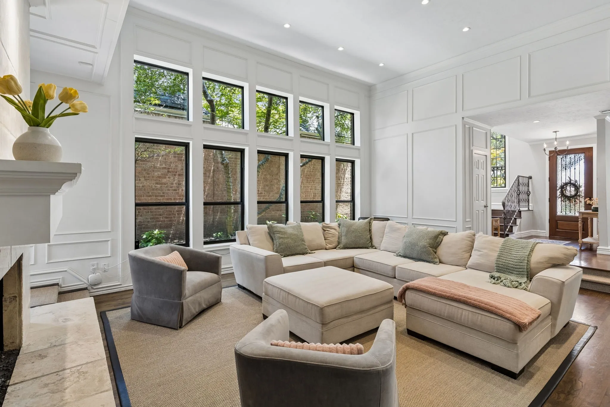 Our favorite part of this home is the sunken family room and wall of windows.