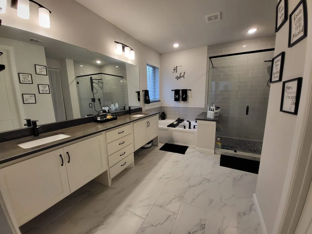 Bathroom with plus walk in shower, tile patterned flooring, and double sink vanity