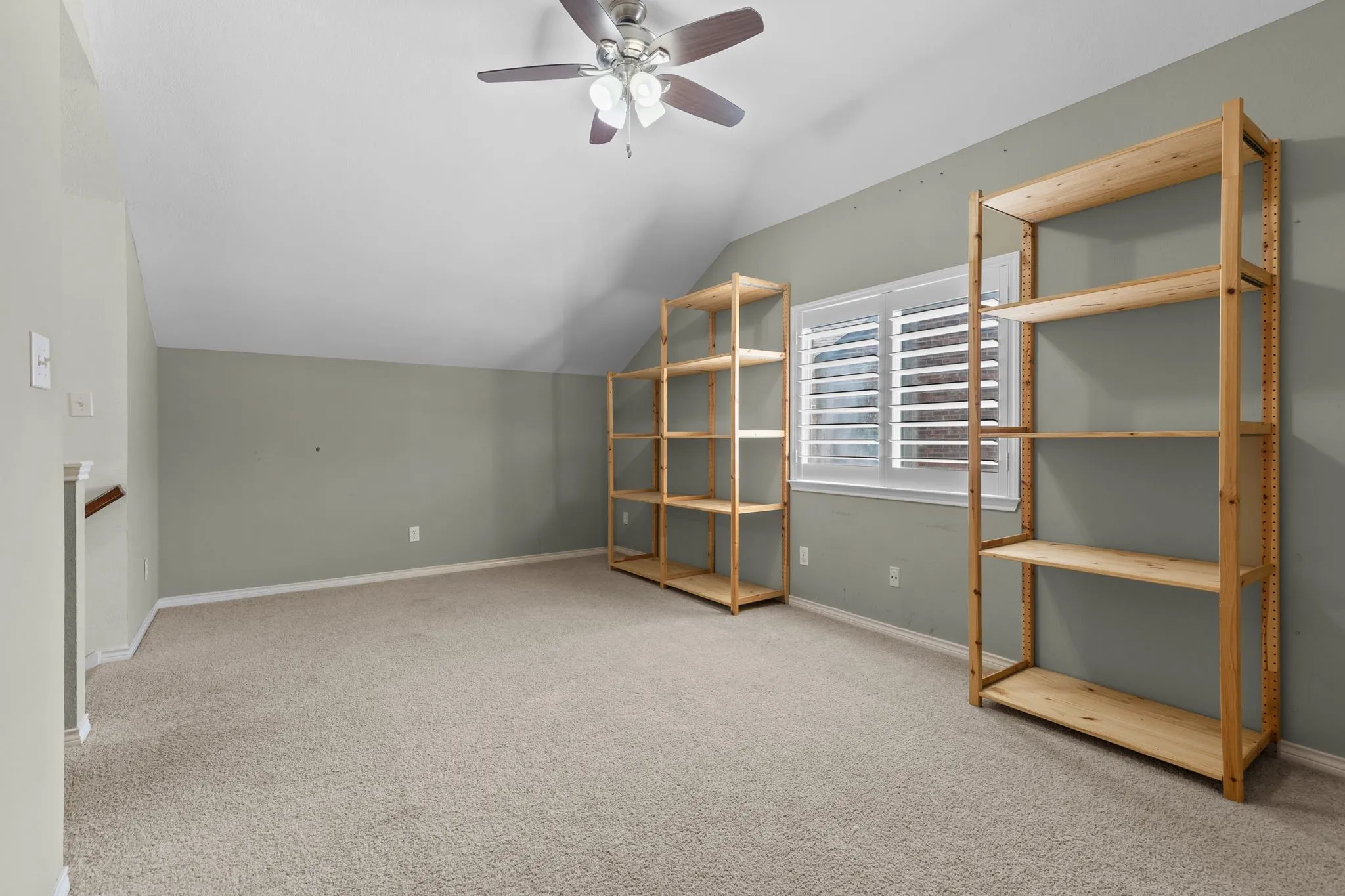 Another view of shelving in room