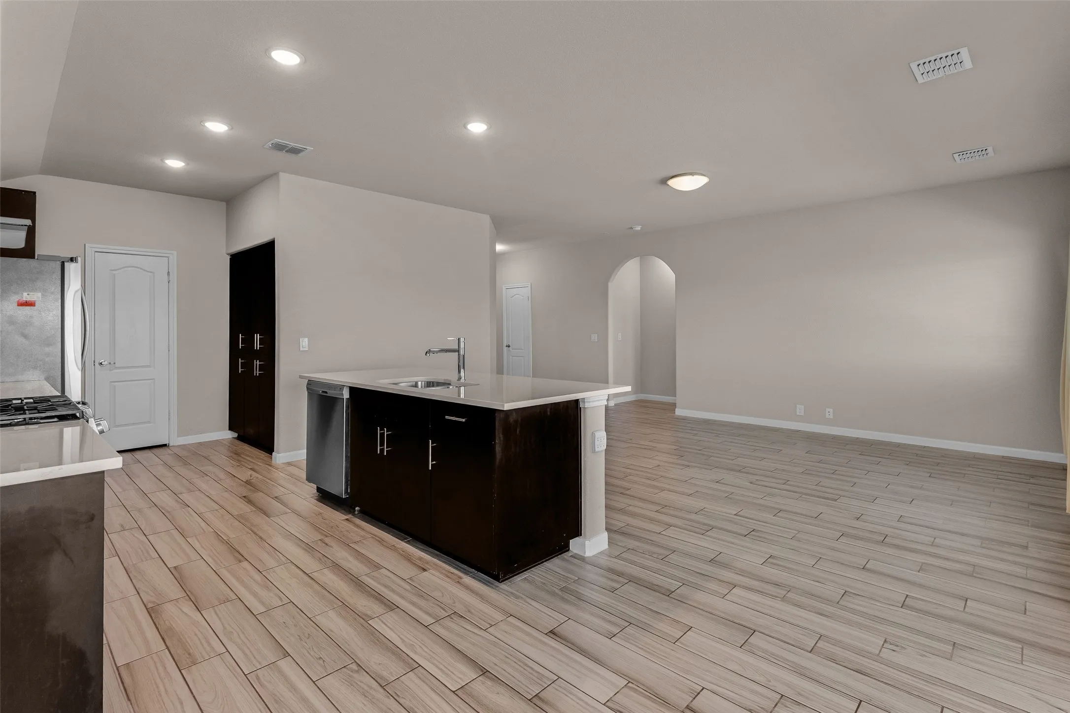 Kitchen island with an undermount sink and a gooseneck faucet