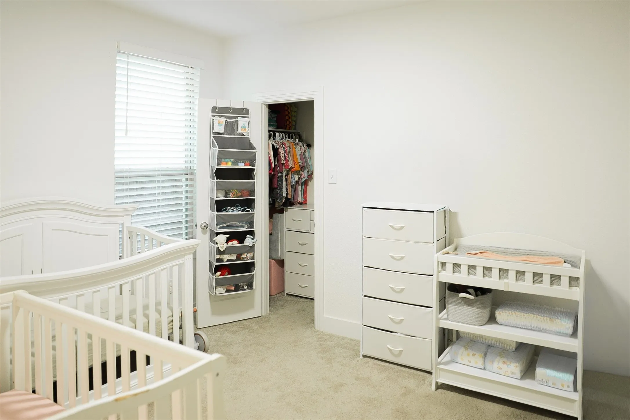 Soft neutral wall paint and carpeting throughout