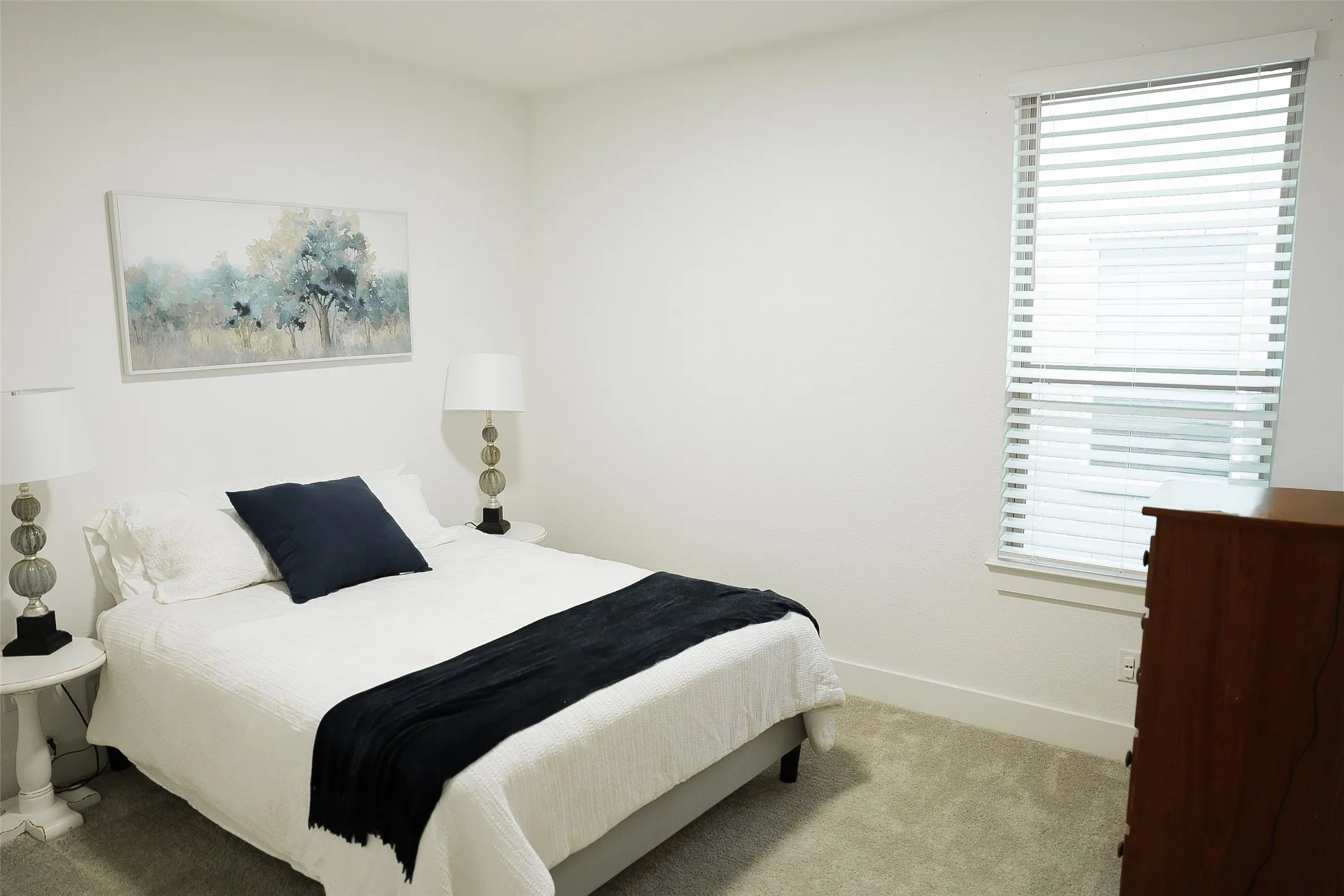 Neutral white walls create a bright ambiance in this room