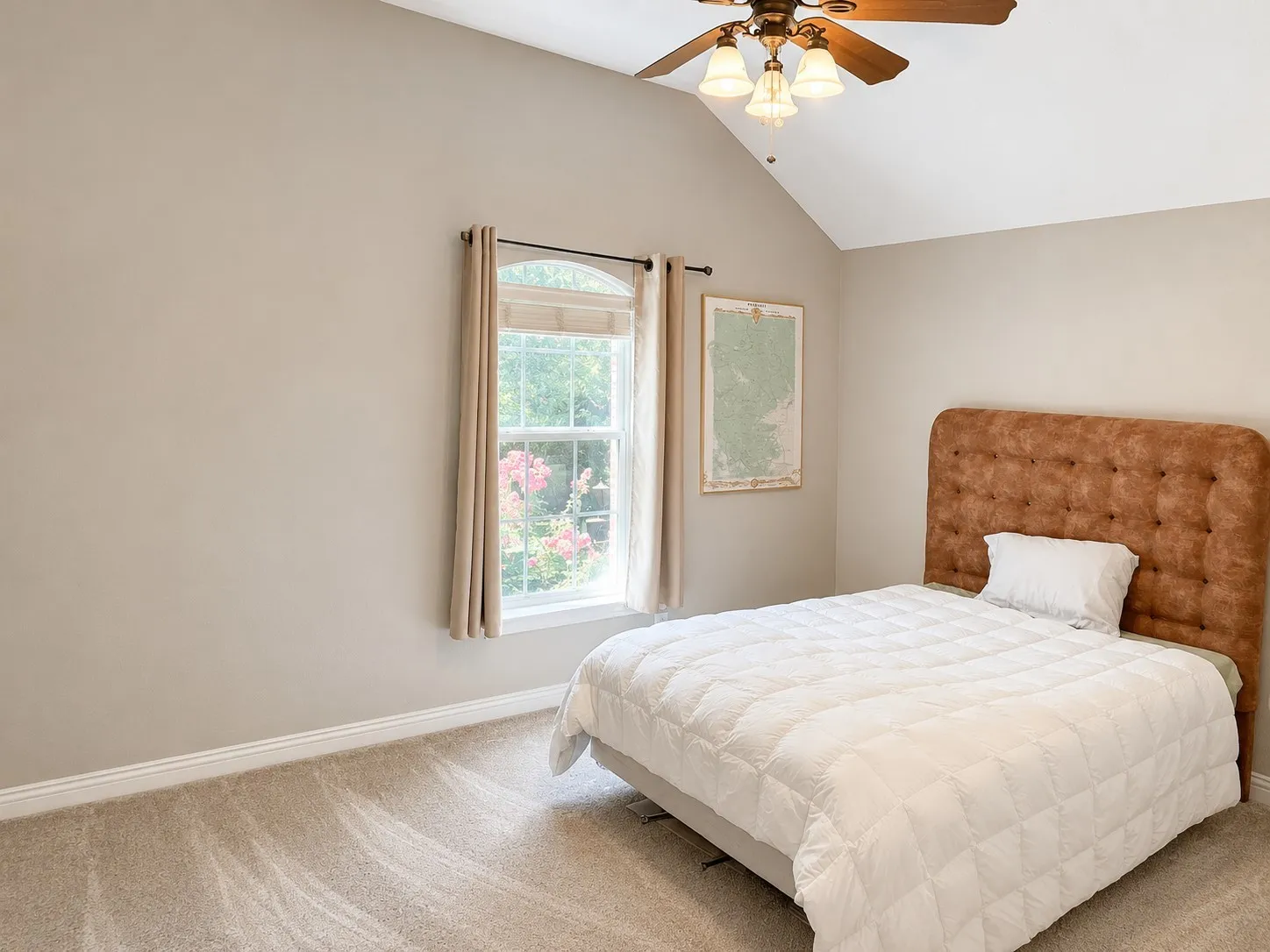 Vaulted ceiling featuring a ceiling fan with integrated lighting