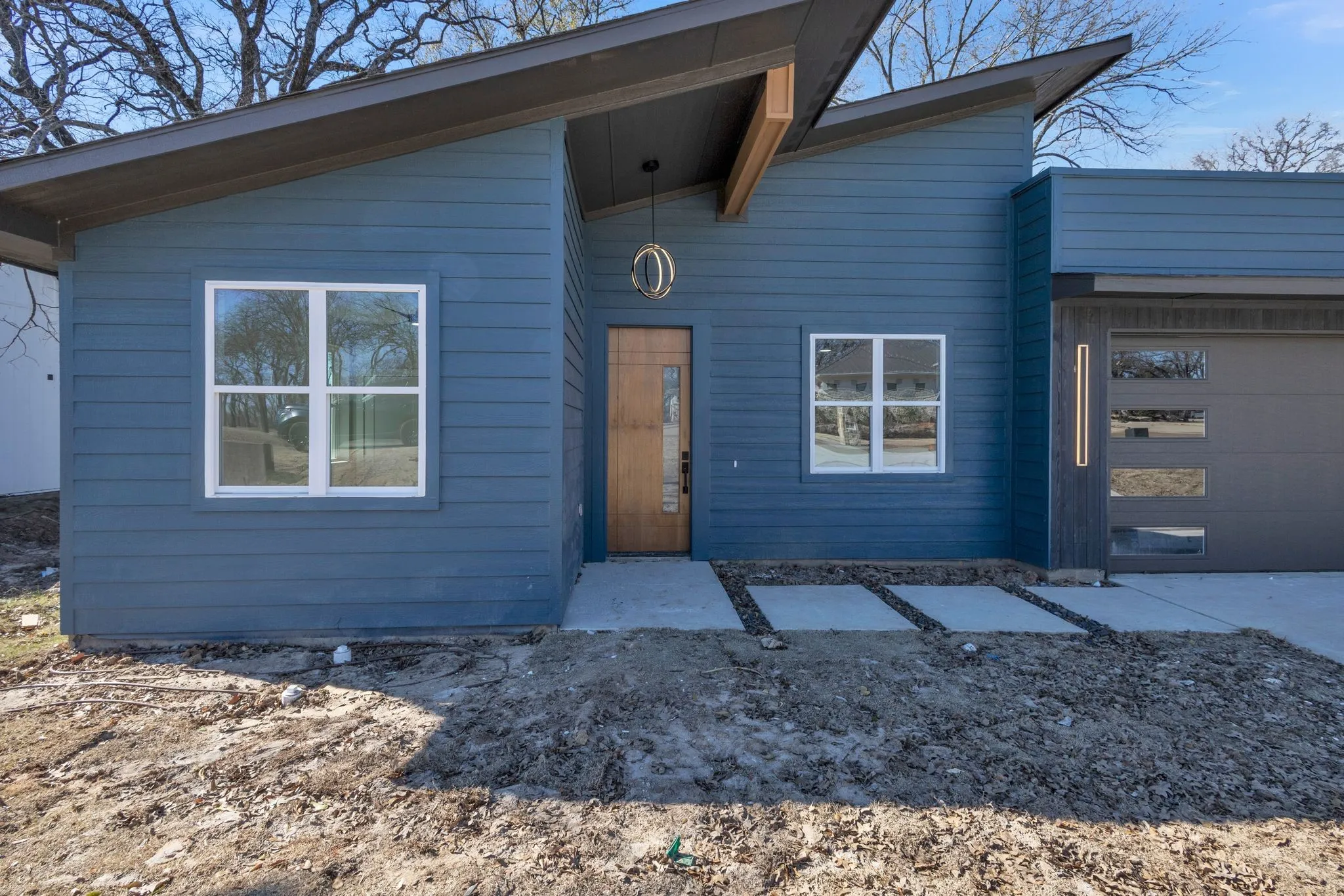 View of front facade featuring a garage