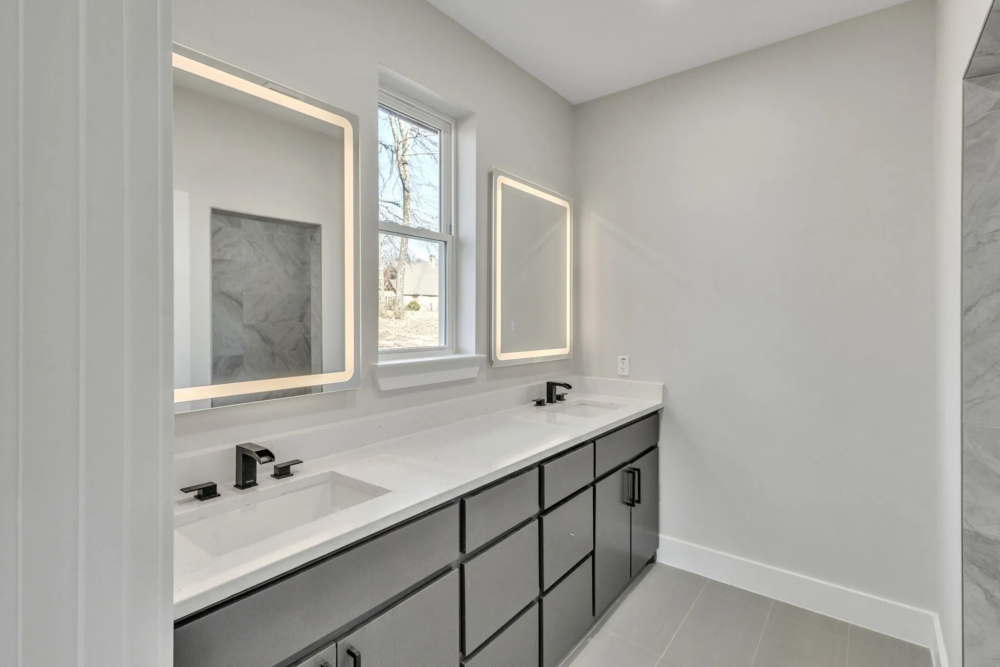 Bathroom featuring vanity and tile patterned flooring
