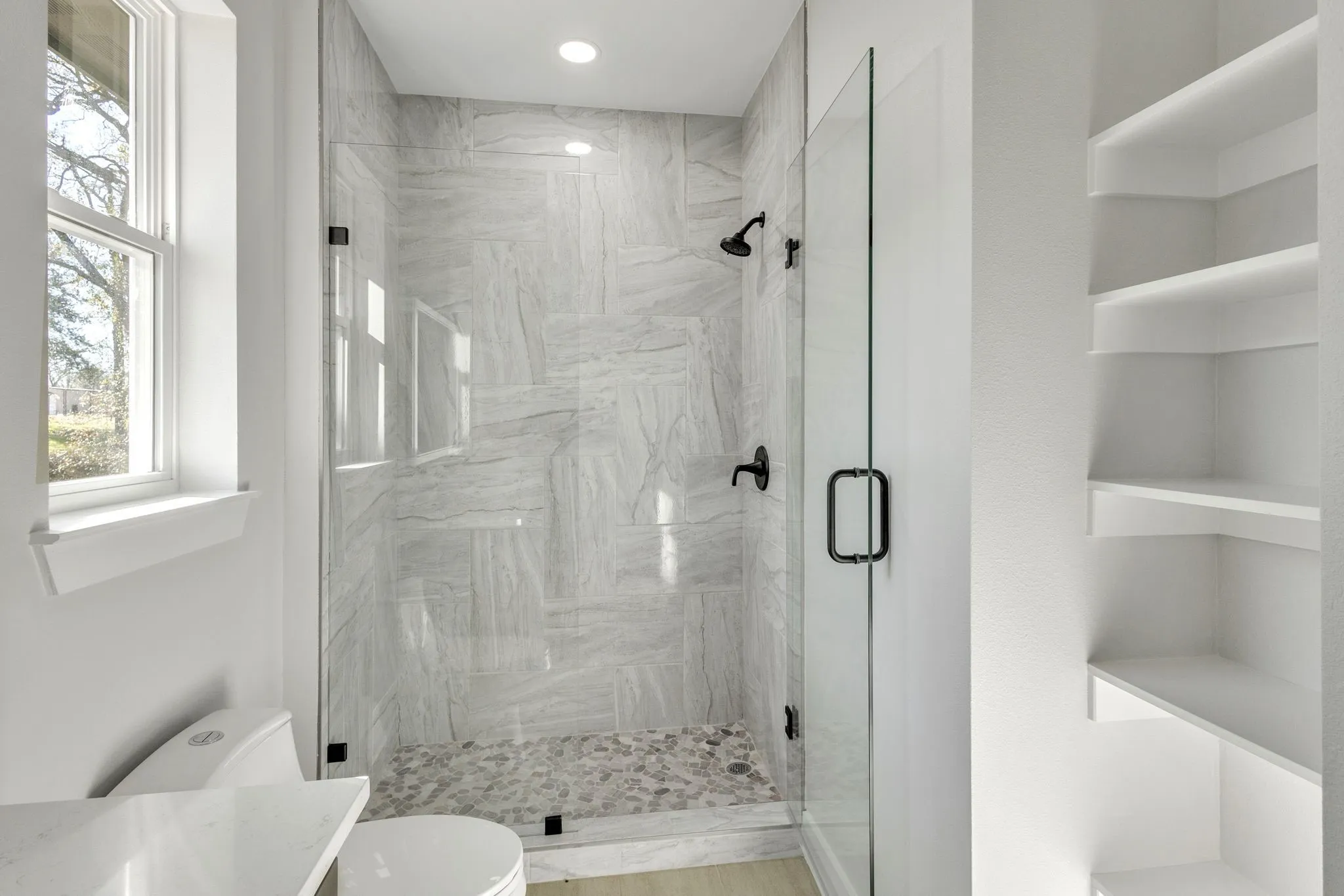 Bathroom featuring toilet and walk in shower