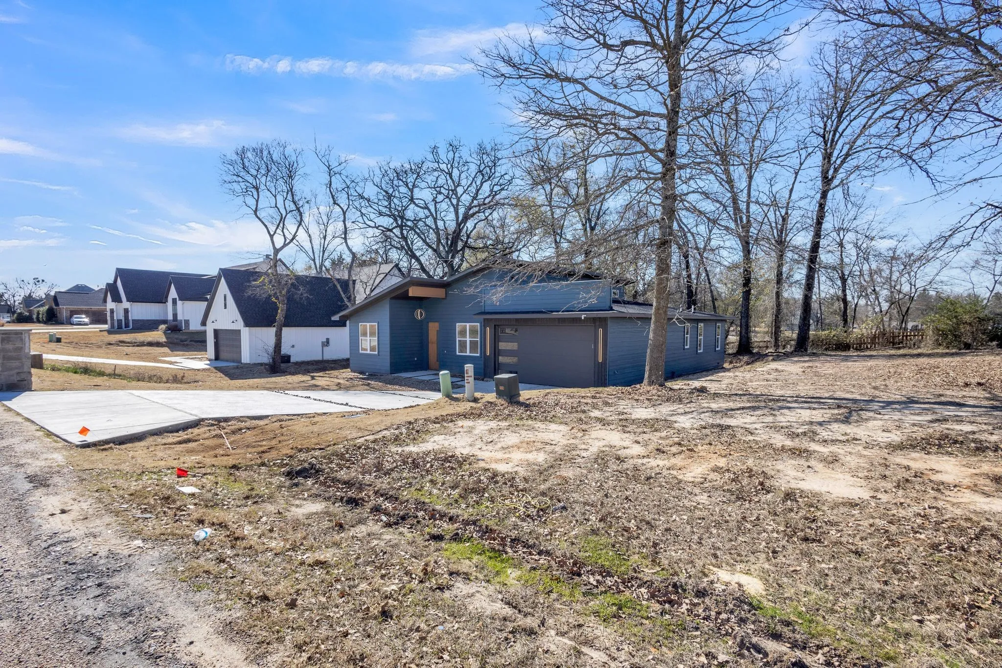Rear view of property with a garage