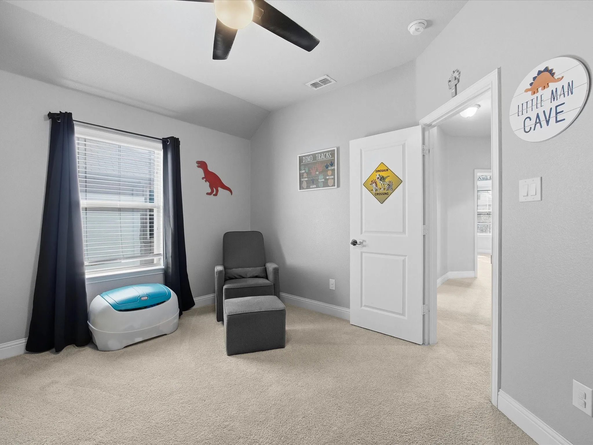 Sitting room with light carpet, lofted ceiling, and a ceiling fan