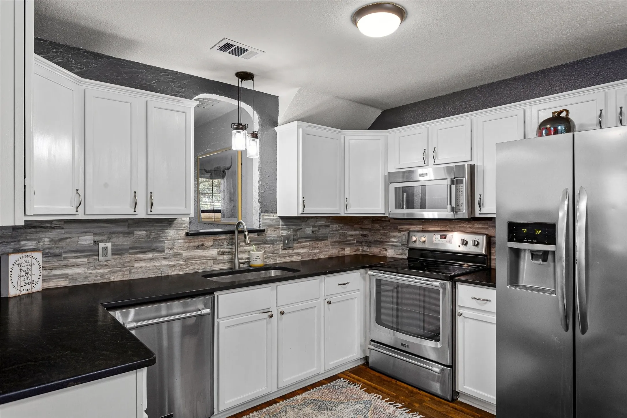 Bright White Kitchen With Granite Counters