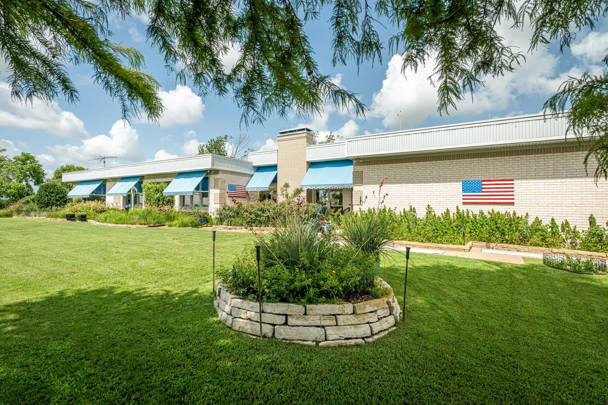 The home is approximately 3,900 sf per the tax records.  The roof is a specialized material -  All have hail proof 20-year Mueller Galvalume Plus 26-gauge R-panel roofing with 55% Aluminum & Zinc alloy coated sheet steel over with a 2” layers of brand new polyisocyanurate insulation foam board over 2 new blankets of 50 mil 1B Superior Membrane (PVC/CPA) roof system which is constructed over existing insulation board form previous 50
mil 1B Superior Membrane roofing system. All roof coping walls are covered with Signature 300 Kynar 500/Hylar 5000 Tundar 2over the entire roofing systems on the Main House, all garages & pump house.  Very high-quality energy factor.  Sunbrella material awnings that are crank down shade over the windows giving a decorative touch & pop as well has shade from sunlight - additional energy factor.  There are 60 wood exterior clad insulated Pella windows & Pella doors. Solar screens on the bottom of double hung windows.  This home was built with quality and attention to energy savings