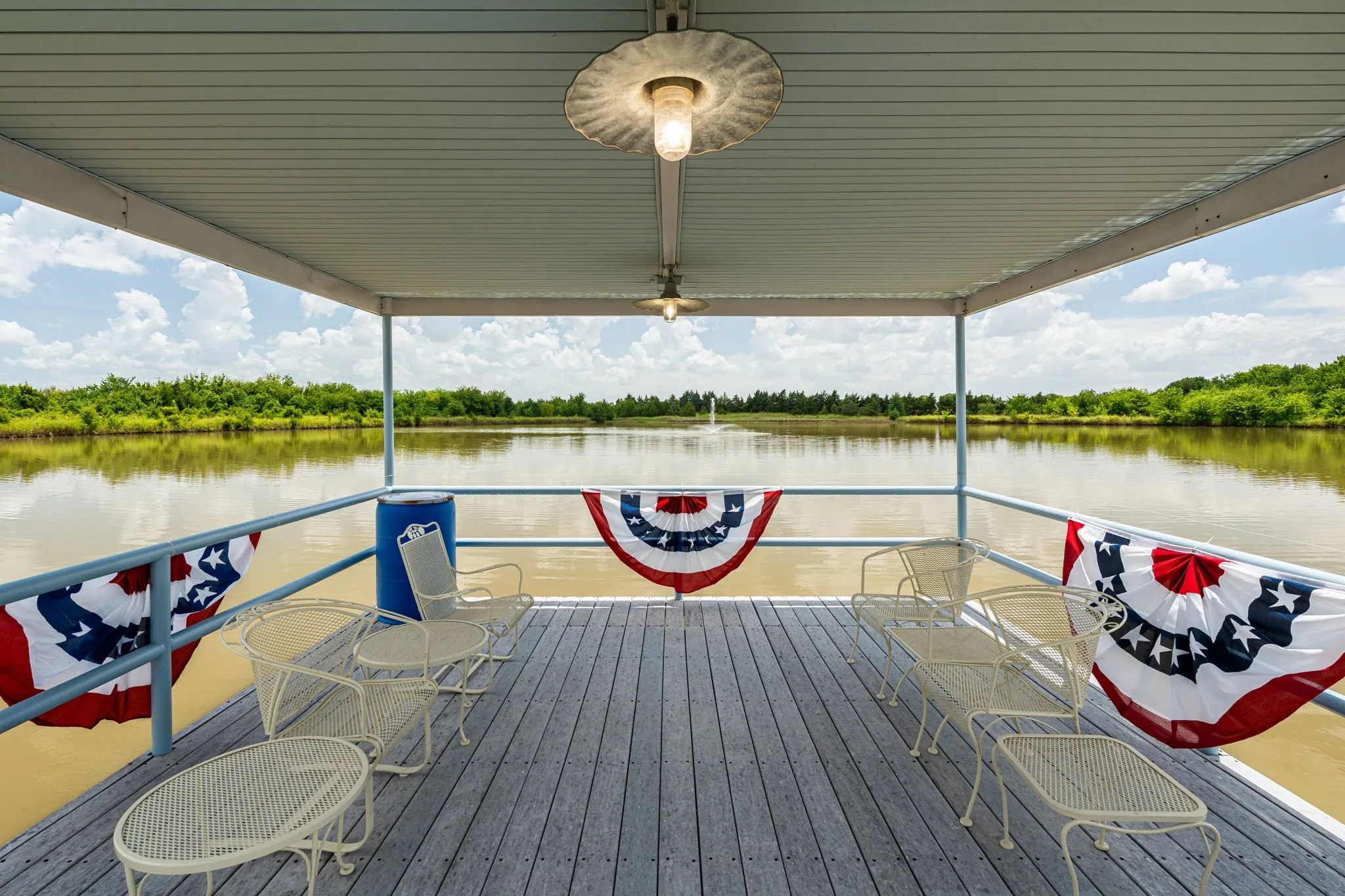 Extended out on Lake Saint Michael, approximately 100 ft of hardwood Trex dock with a lovely scenic covered area for enjoyment.  A wonderful eve of entertaining & relaxation while you have a distant view of the lighted fountain.  Note the safety feature of this area with 4 inch steel pipe double stacked railing.