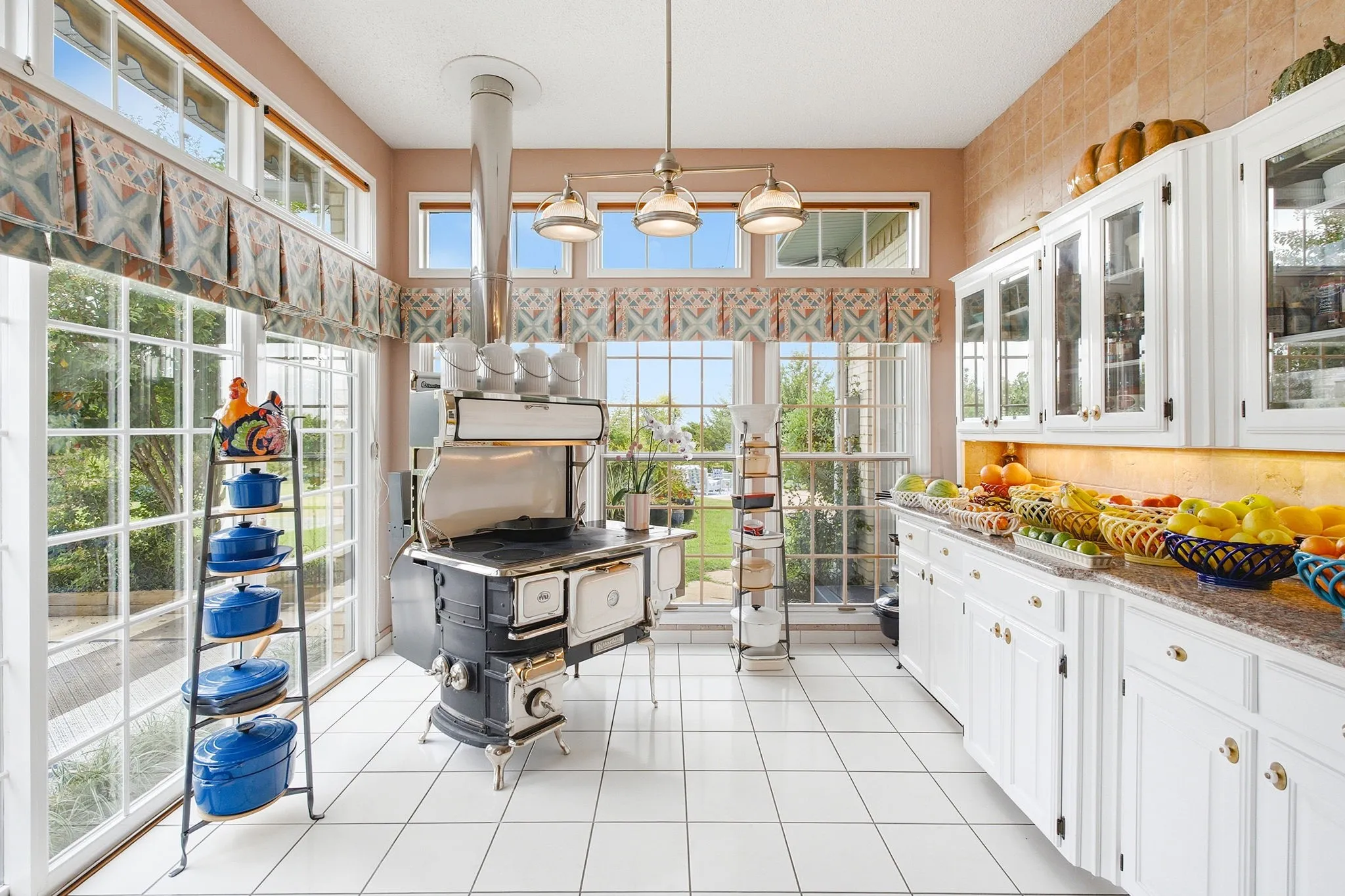 Charming kitchen that is spacious and would make a chef smile.  Outstanding space, built-in hutch, extensive granite countertops and focal oval wood burning stove is a Heartland that was imported from Canada - has 6 burner cooktop & copper lined hot water reservoir and an amazing cook stove.