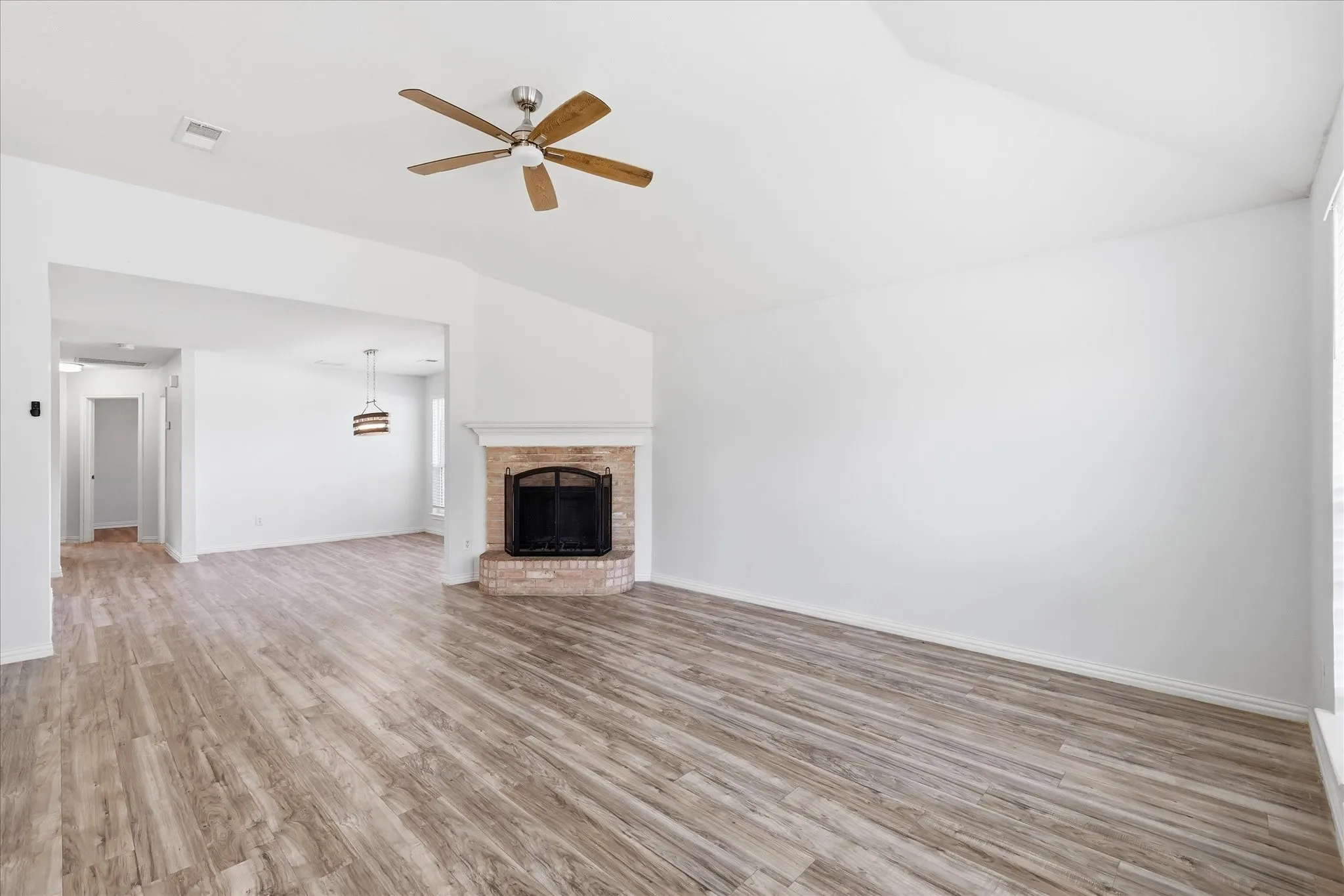 Main living area with high ceilings, sized to comfortably fit a full sectional and coffee table.
