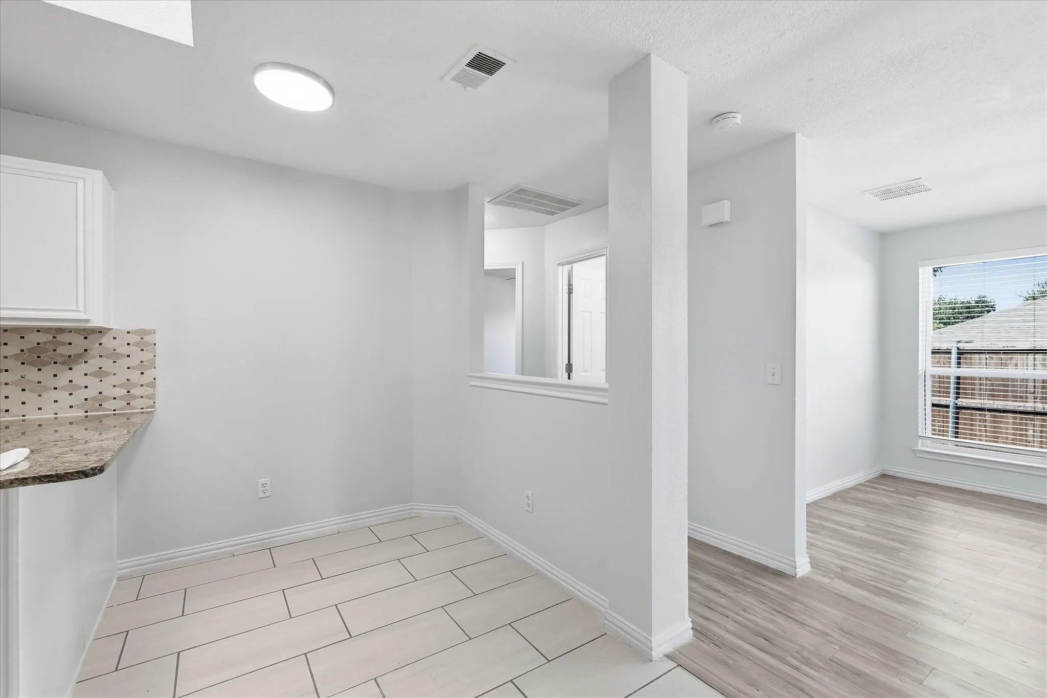  Open-concept kitchen layout with a clear sightline into the adjacent living and dining rooms.