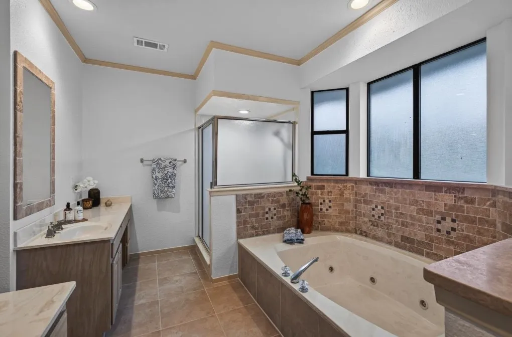 Primary ensuite soaking tub, and seperate shower