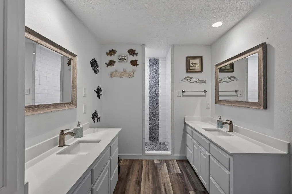 Guest bathroom located in hall, walk in shower.