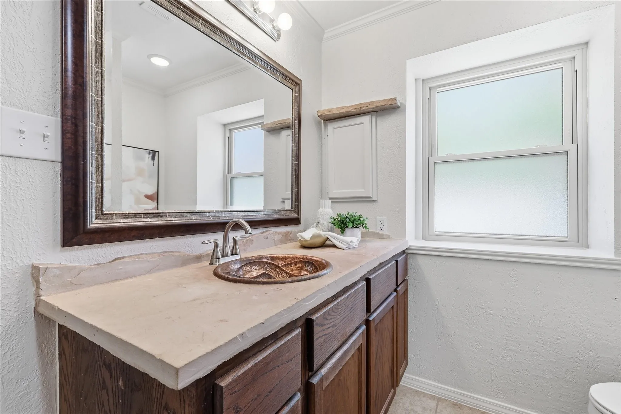Primary bathroom with frosted privacy window