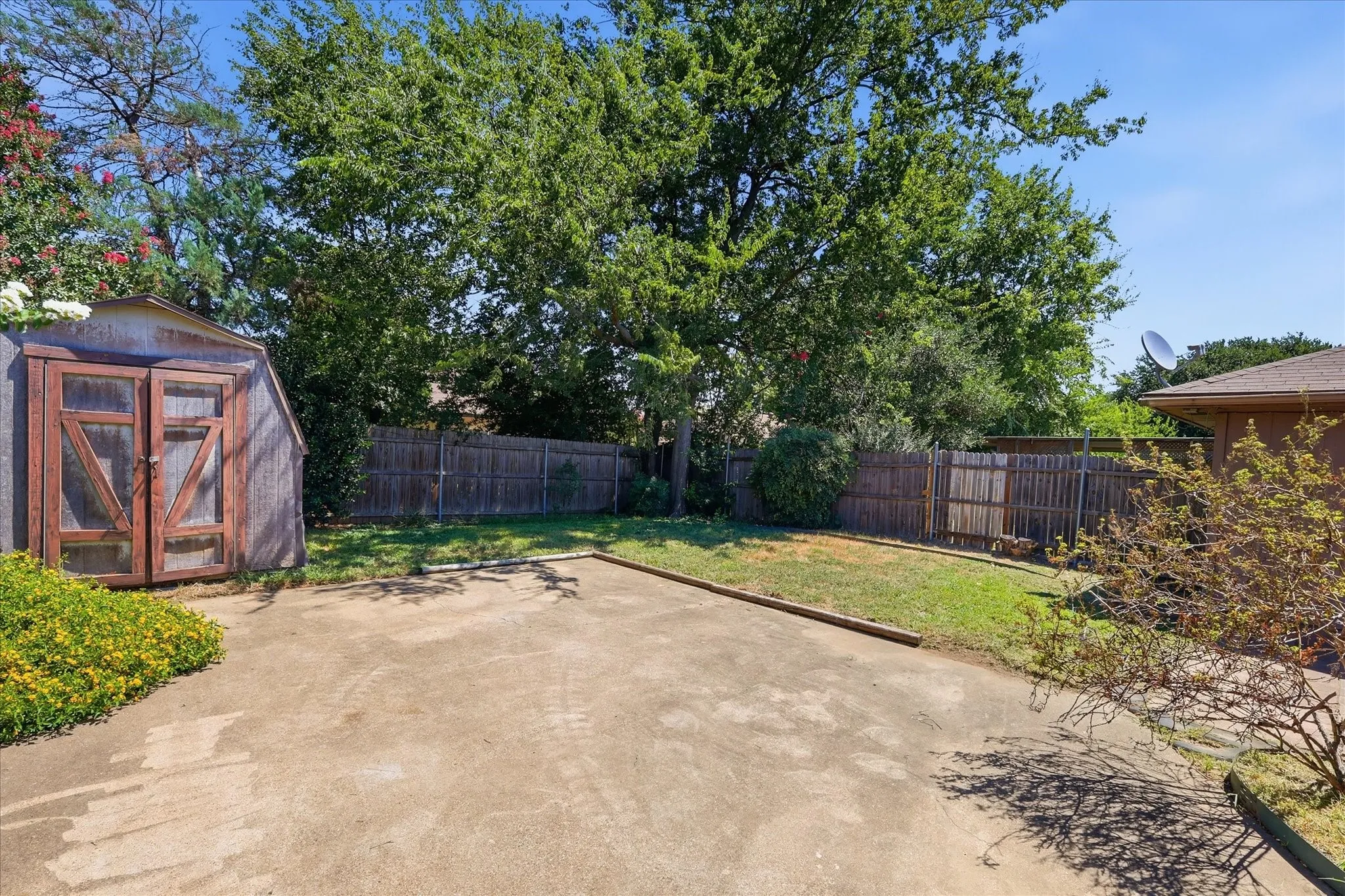 Ample parking, manageable backyard grass, and a large storage shed