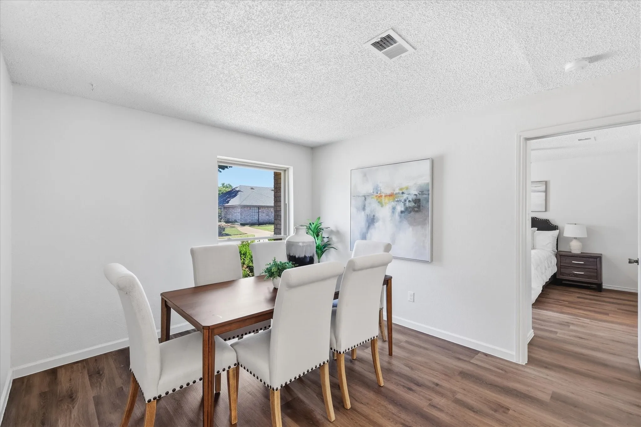 Versatile dining space could serve as office, sitting room, or even become an additional bedroom