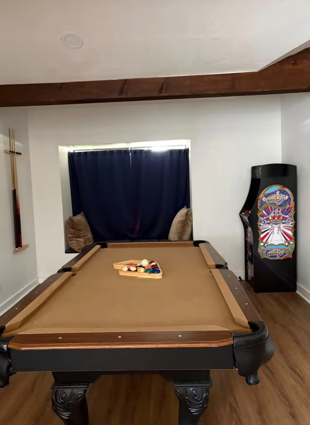 Recreation area featuring wood-finish flooring, exposed ceiling beams, and recessed lighting