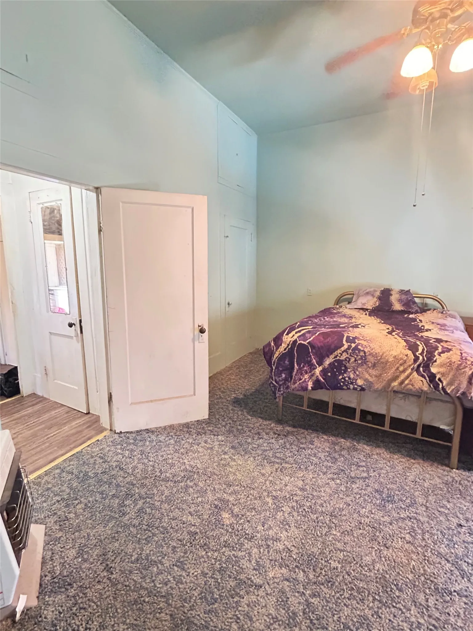  Another view of your Primary Bedroom with high ceilings, nice carpet, and plenty of light.