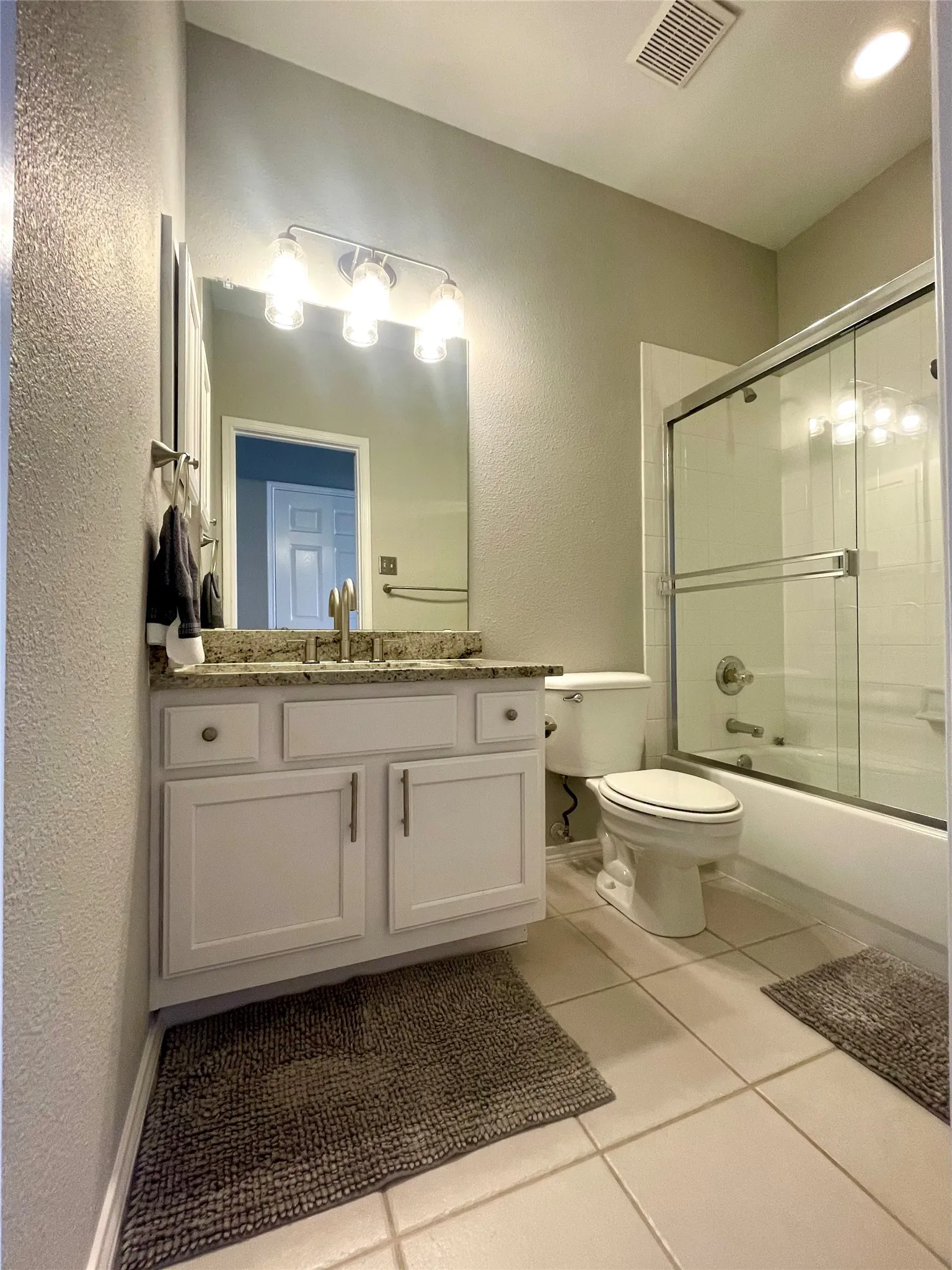 Guest bathroom with new granite, faucet and light