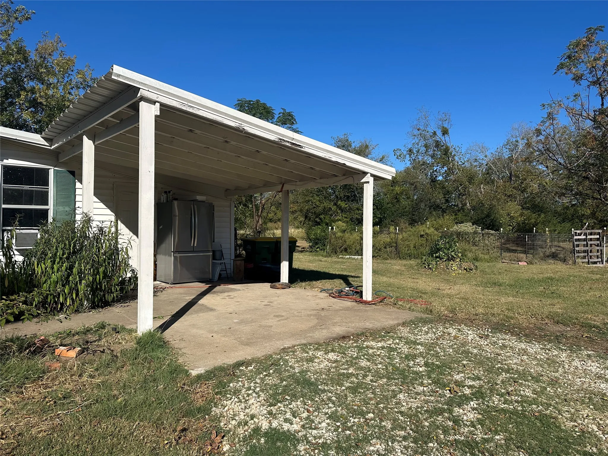 Carport or covered patio area.