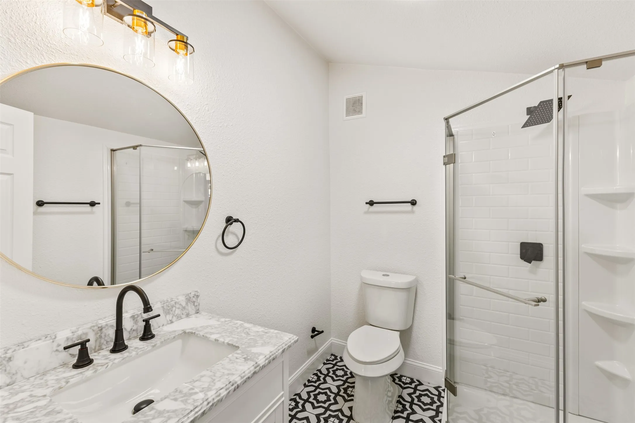 Vanity with rectangular sink and stone-finish countertop