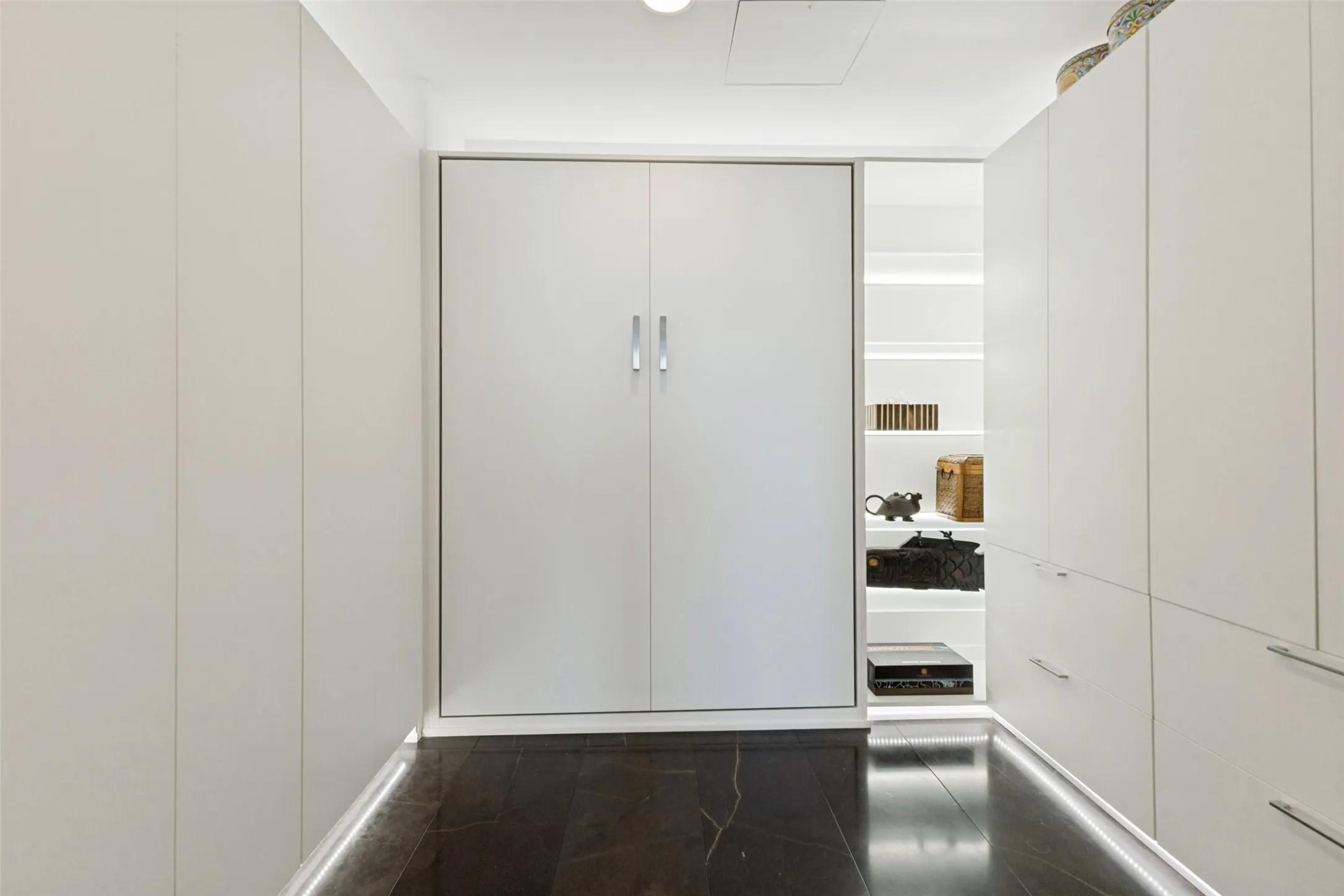 Custom closet with pull down bed for extra guest stay