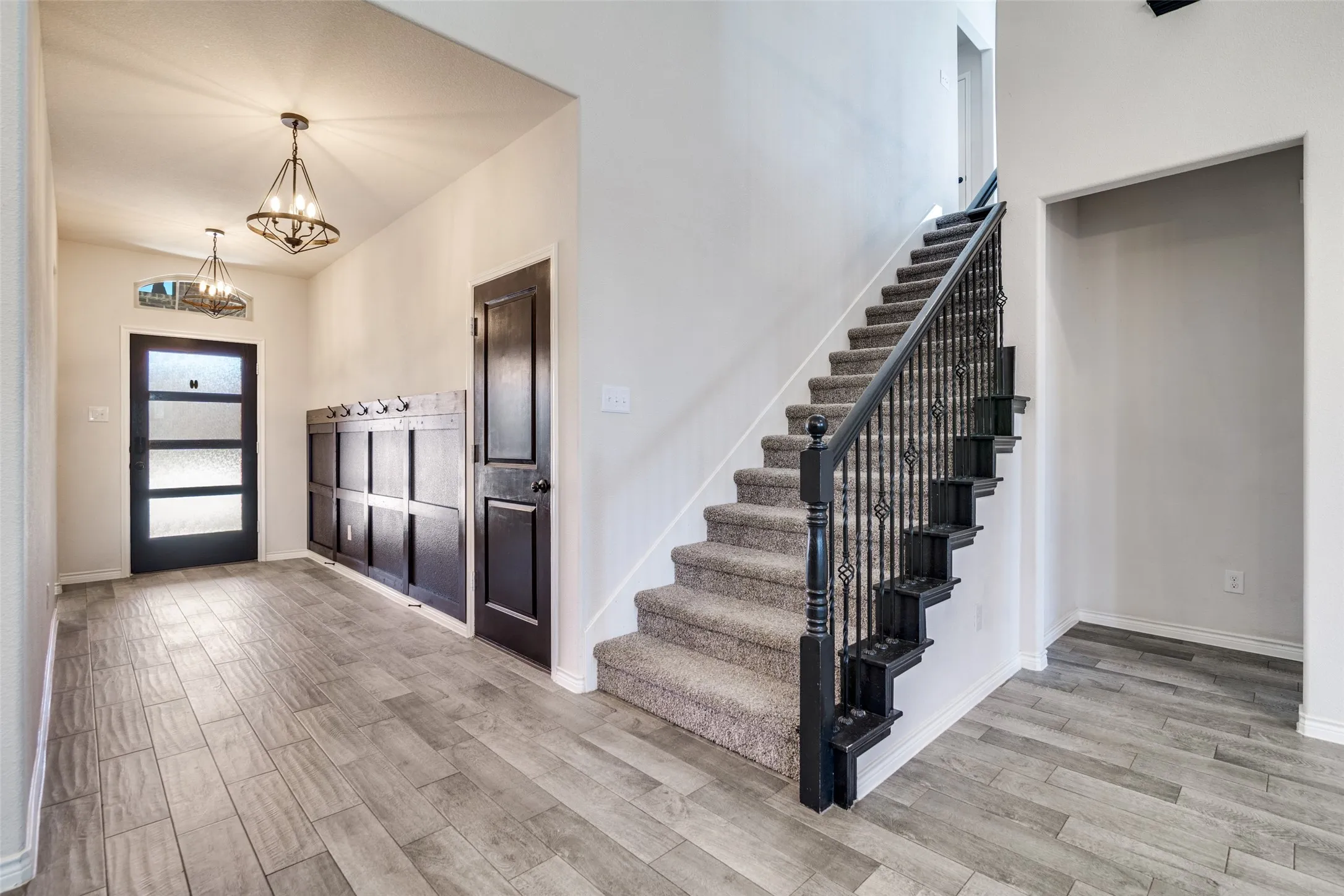 Custom wood work in entry as well as wood like flooring throughout.