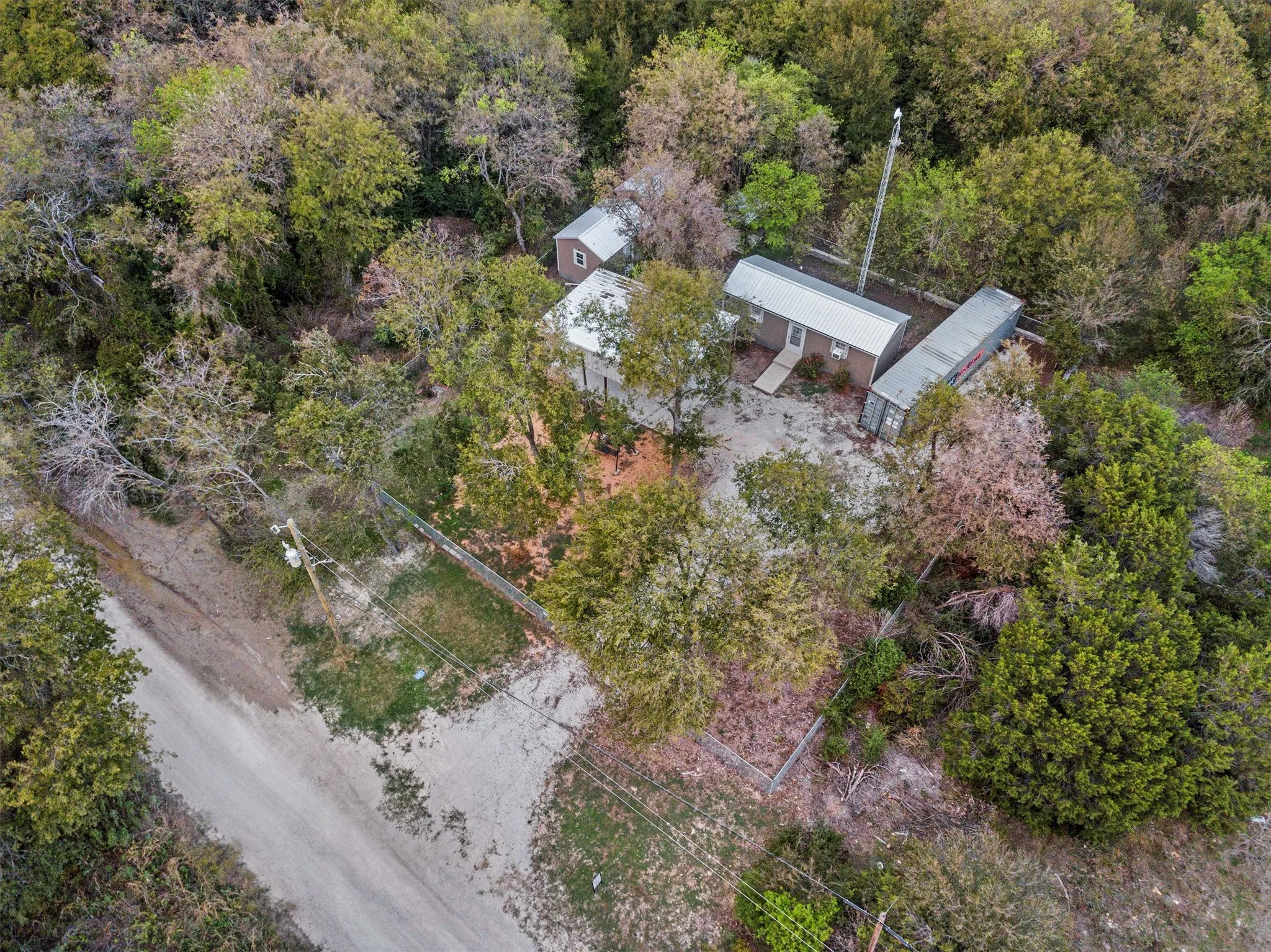 Nestled among the trees.property amidst dense tree cover