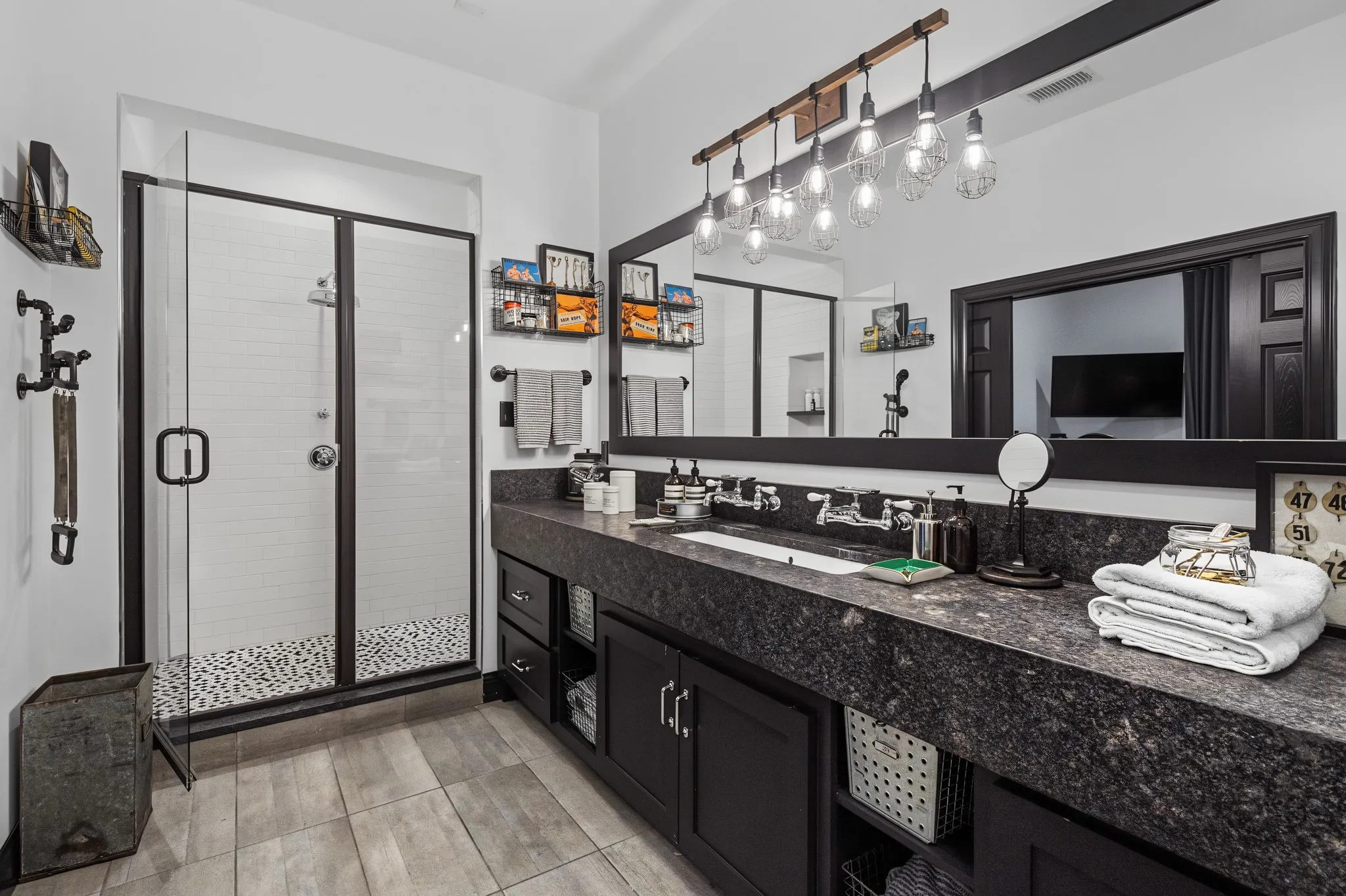Upstairs primary bathroom with leathered granite counters.