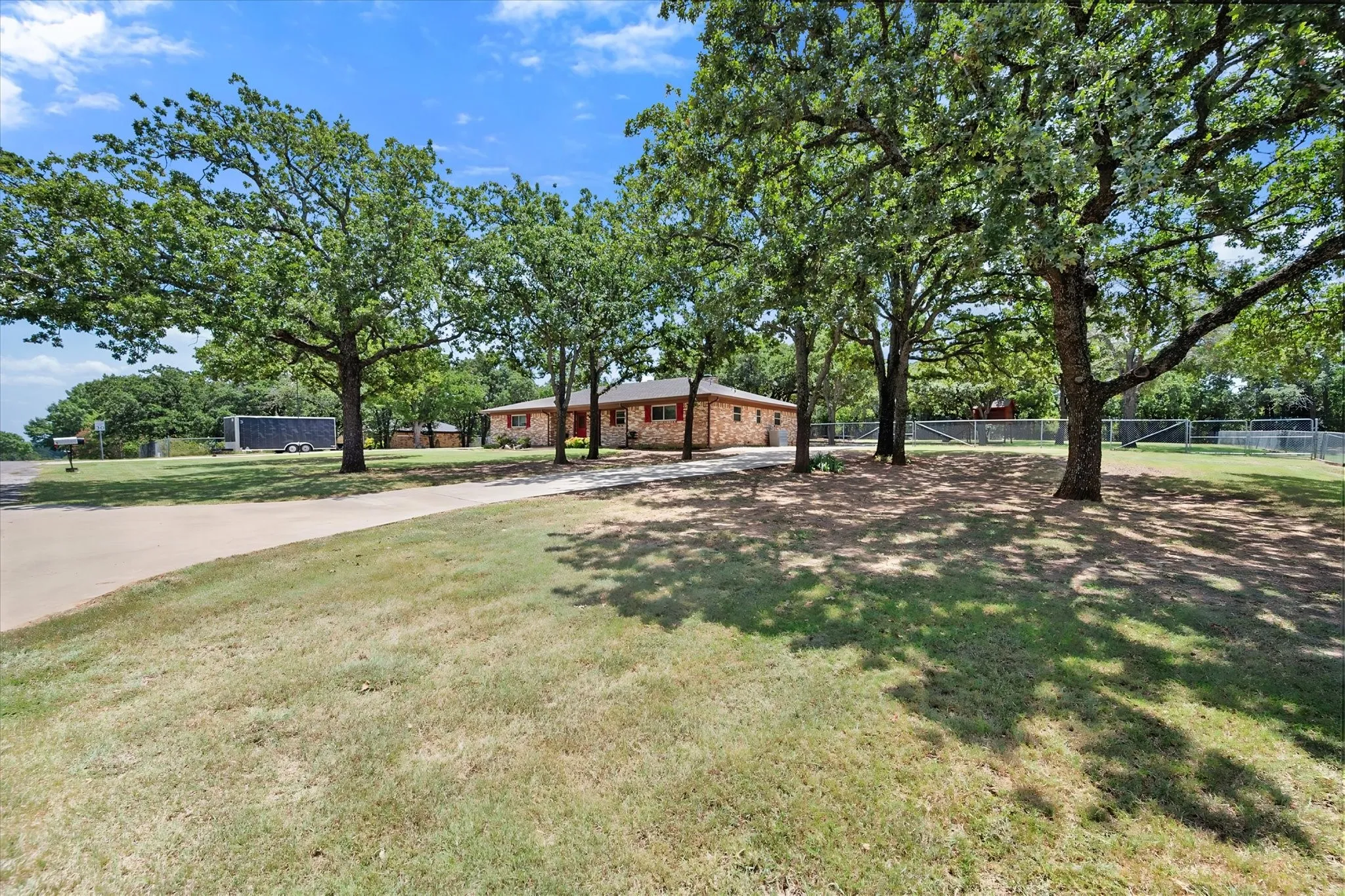 Second driveway with gate leading to backyard