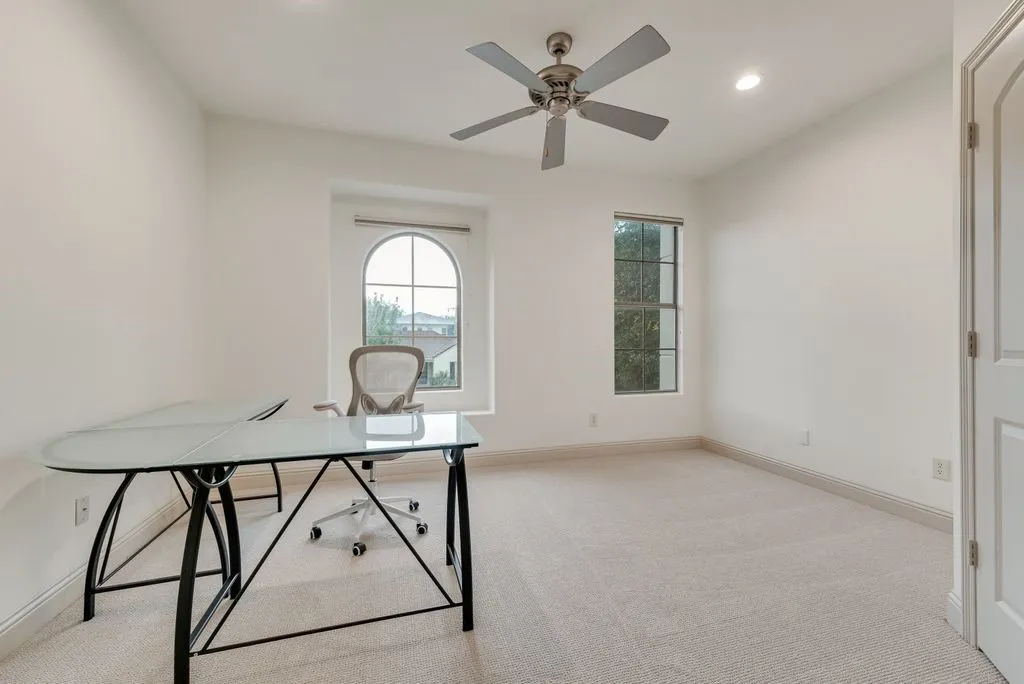 Bright room featuring a contemporary ceiling fan, recessed lighting, and soft carpet flooring