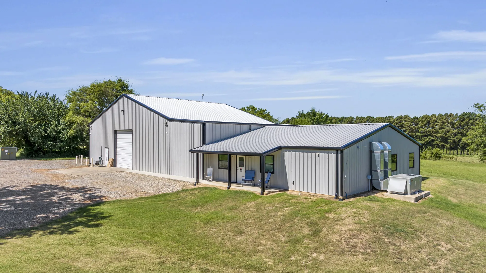 Metal-sided structure featuring an integrated covered porch