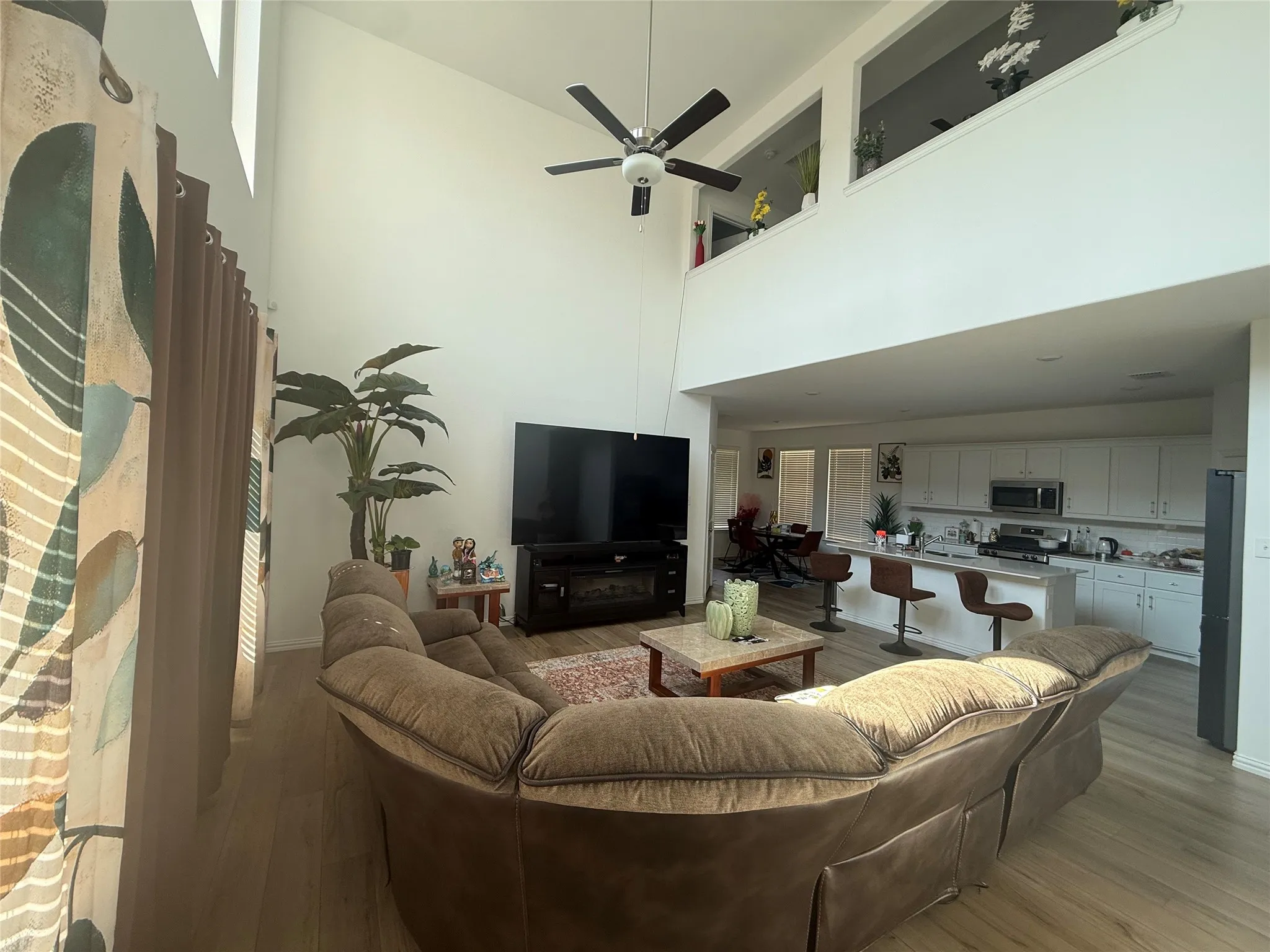 Soaring vaulted ceilings define this living space