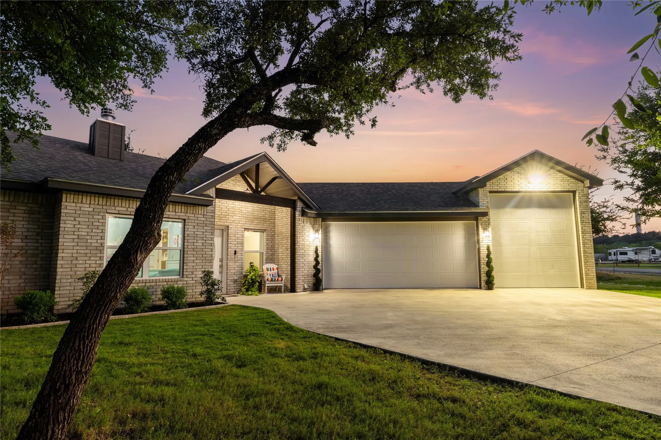 Brick exterior with a prominent multi-car garage