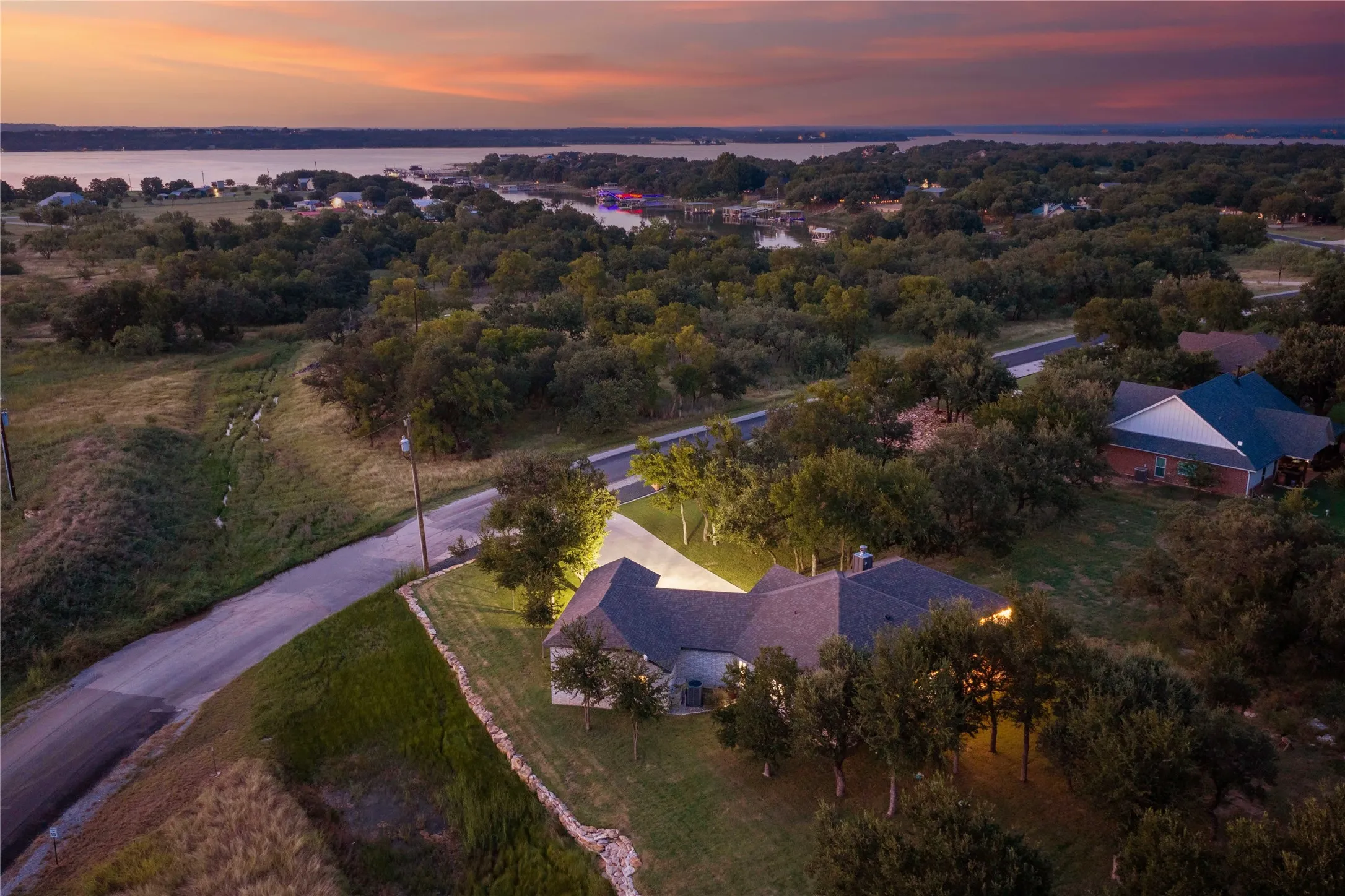 Beautiful property featuring a single-story residence, mature trees, and a substantial setback from the road