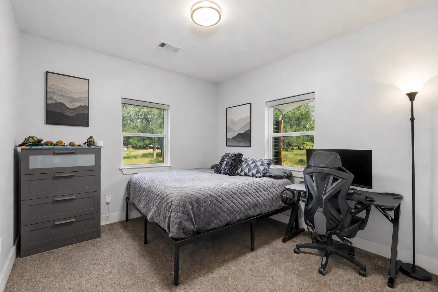Carpeted room featuring two windows, recessed lighting, and white walls