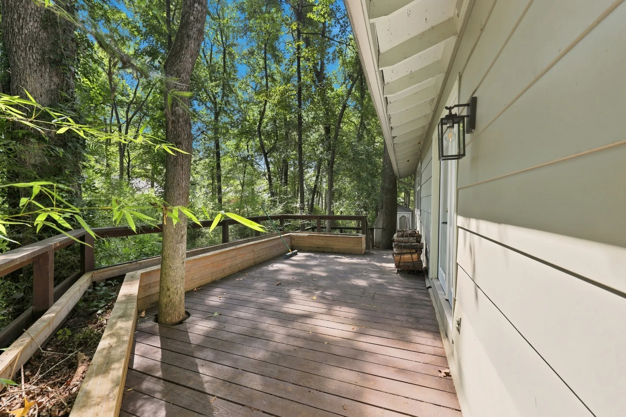 Wood deck with natural wood railing and integrated planters