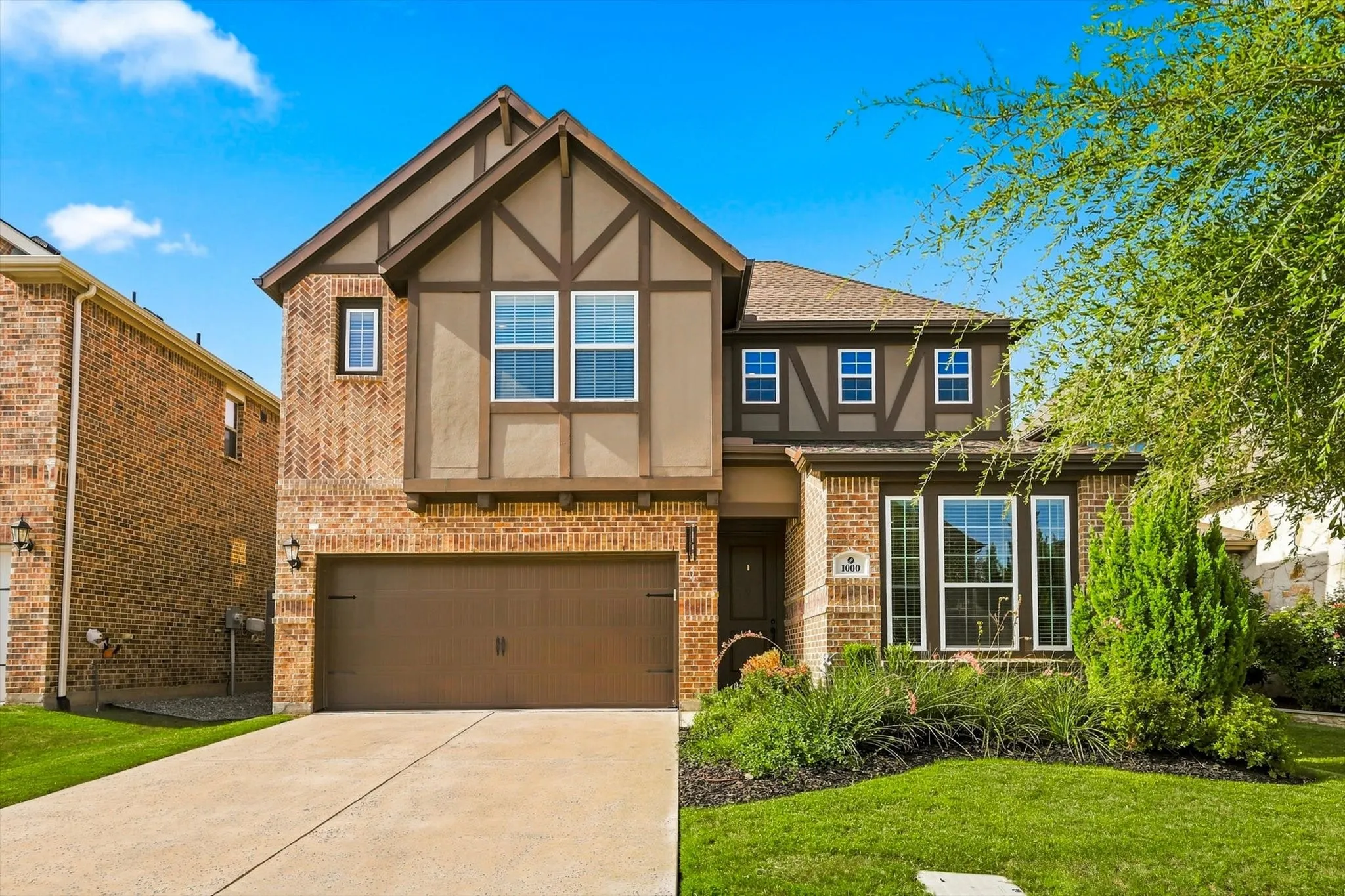 Brick and stucco exterior with Tudor-style gables