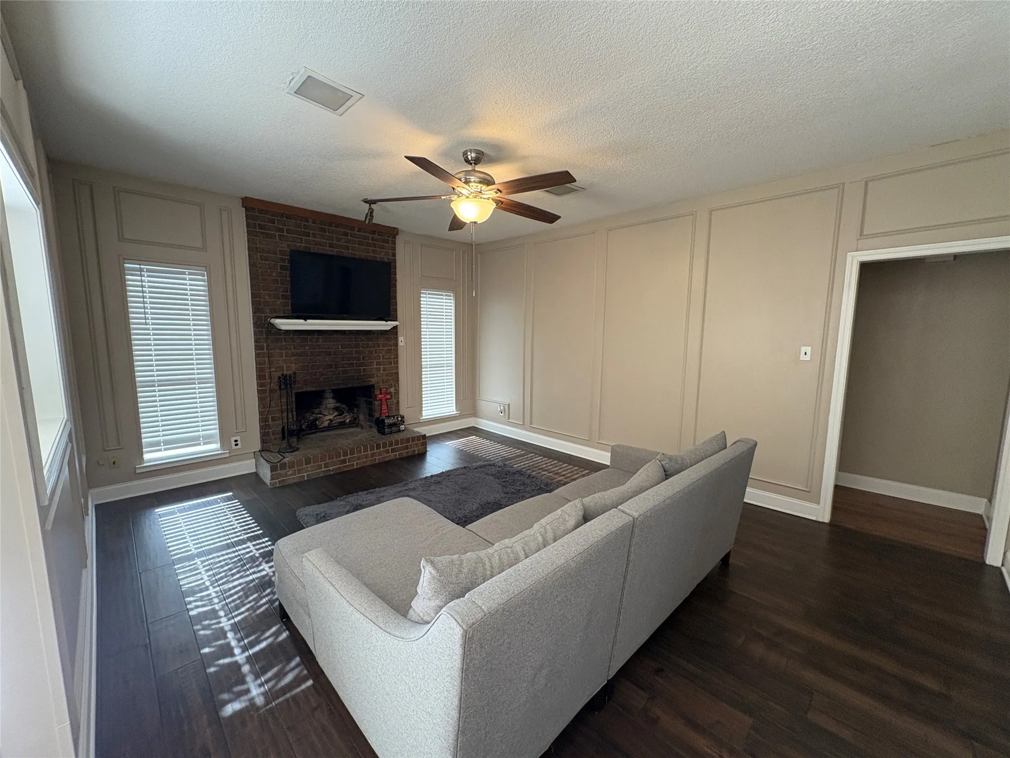 Spacious living area with wood burning firepl