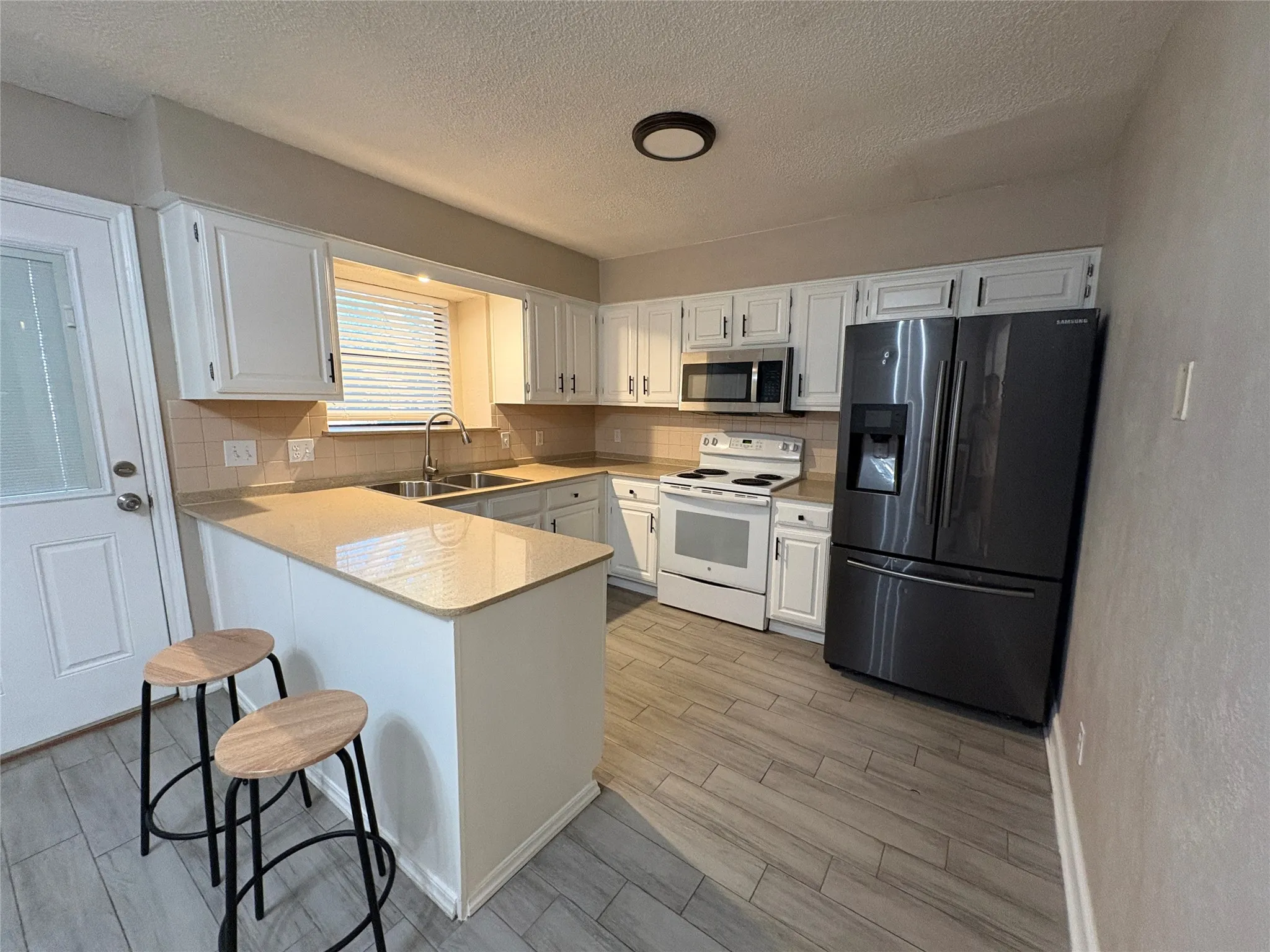 Granite countertop and fridge included