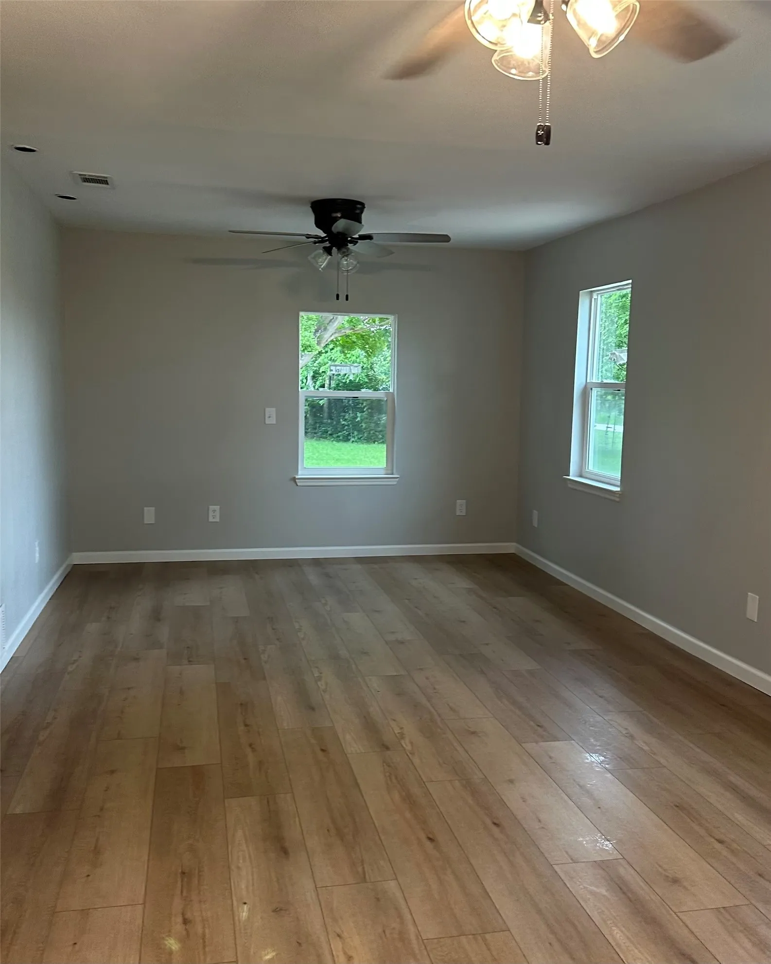 Wood-finish flooring throughout, complemented by neutral wall tones