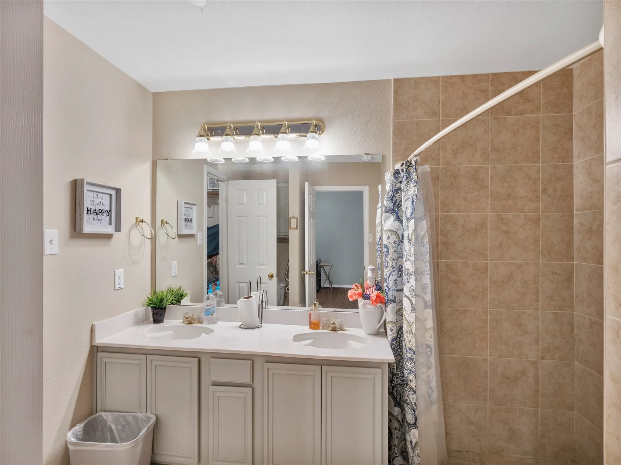 Dual vanity with a white countertop and integrated sinks