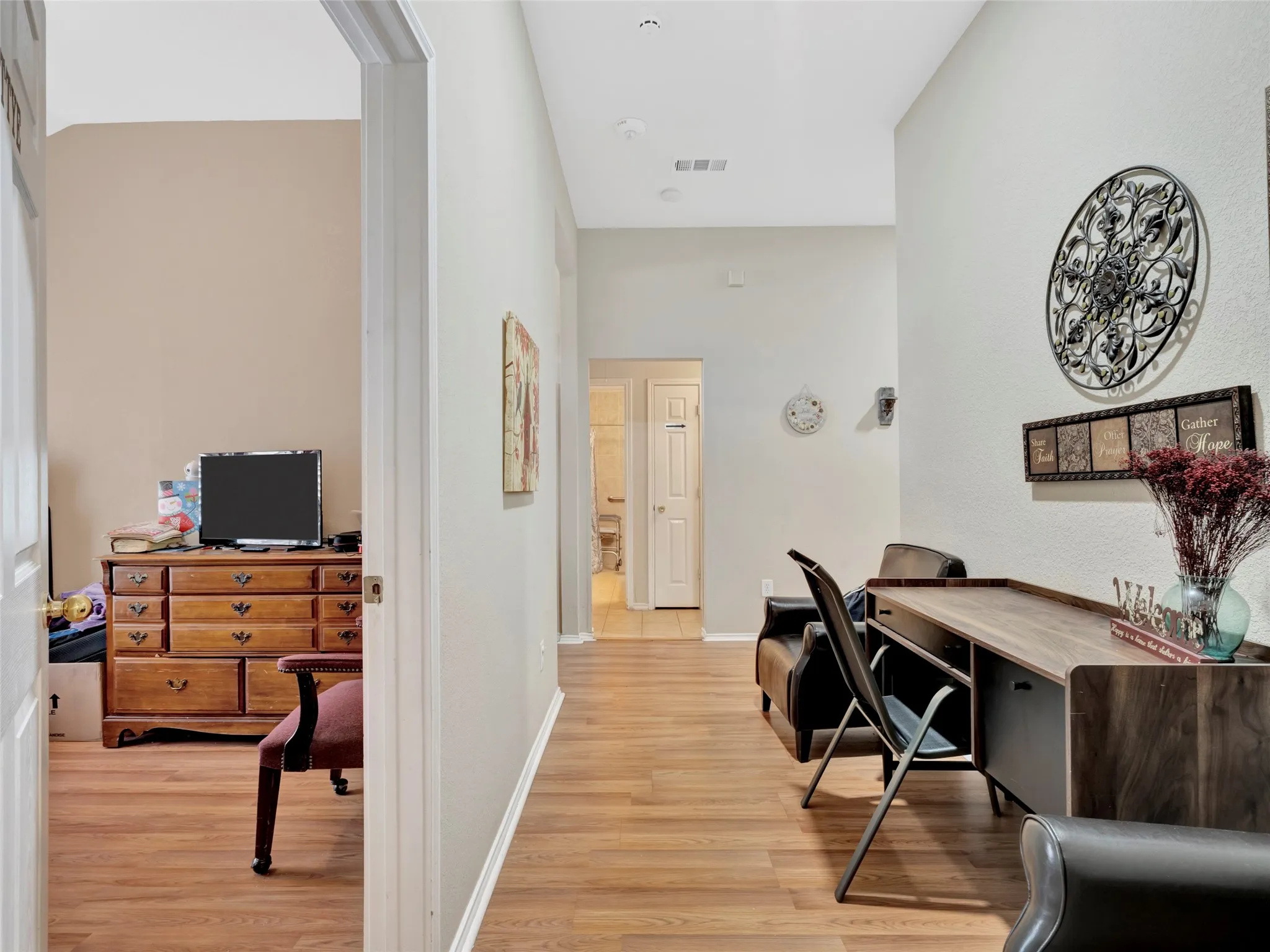 Wood-finish flooring throughout, with a neutral wall palette
