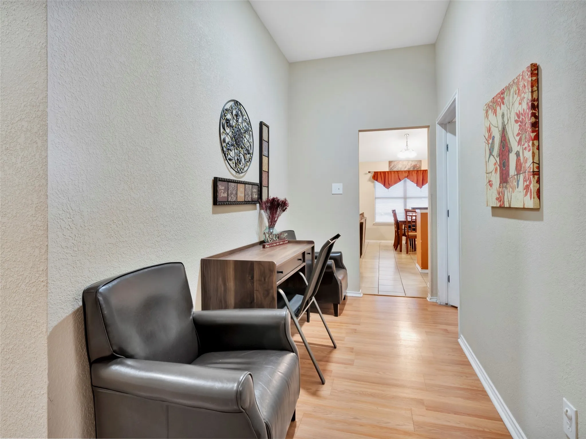 Wood-finish flooring throughout the hallway