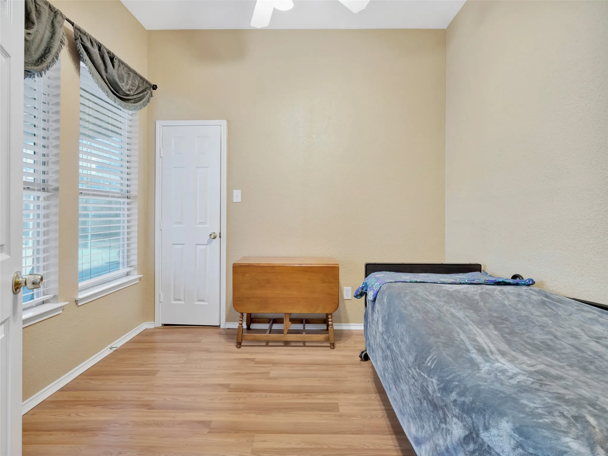 High ceilings and wood-finish flooring