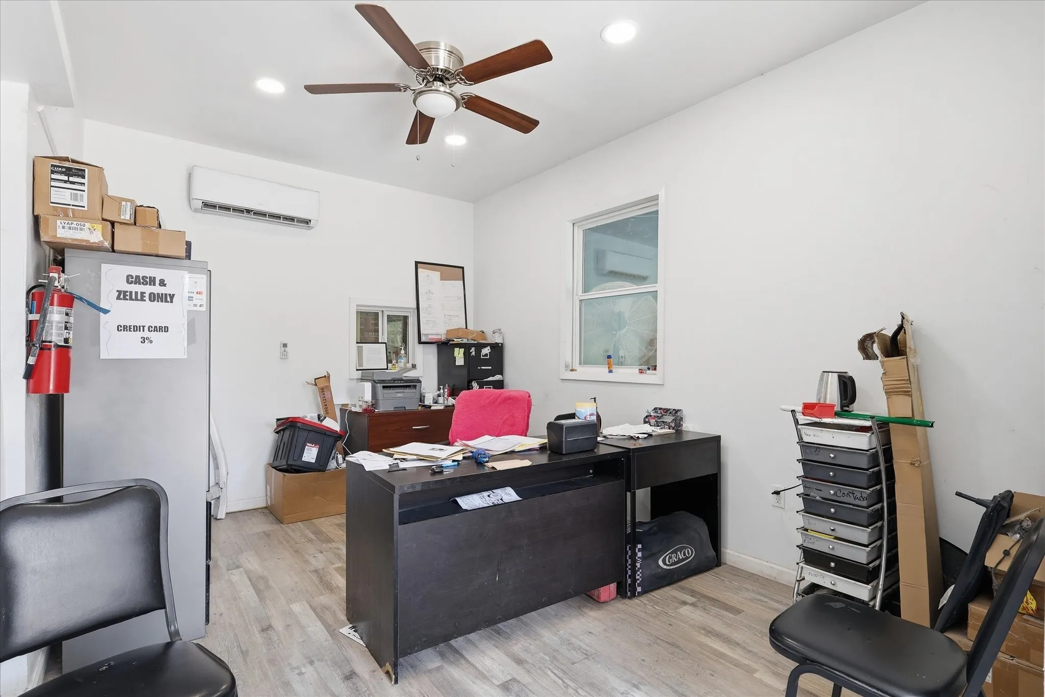 Room featuring wood-finish flooring, recessed lighting, and a ceiling fan
