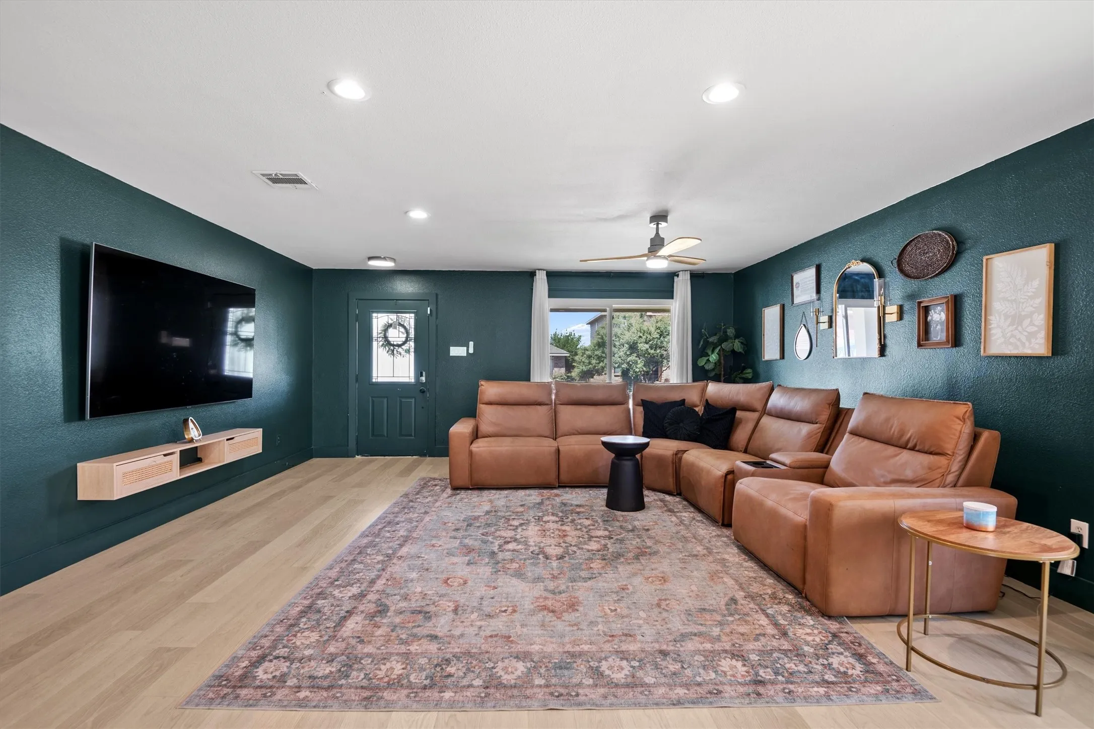 Look at that custom paint! This spacious living room is absolutely beautiful and offers plenty of room to relax and entertain.amazing size and just beautiful